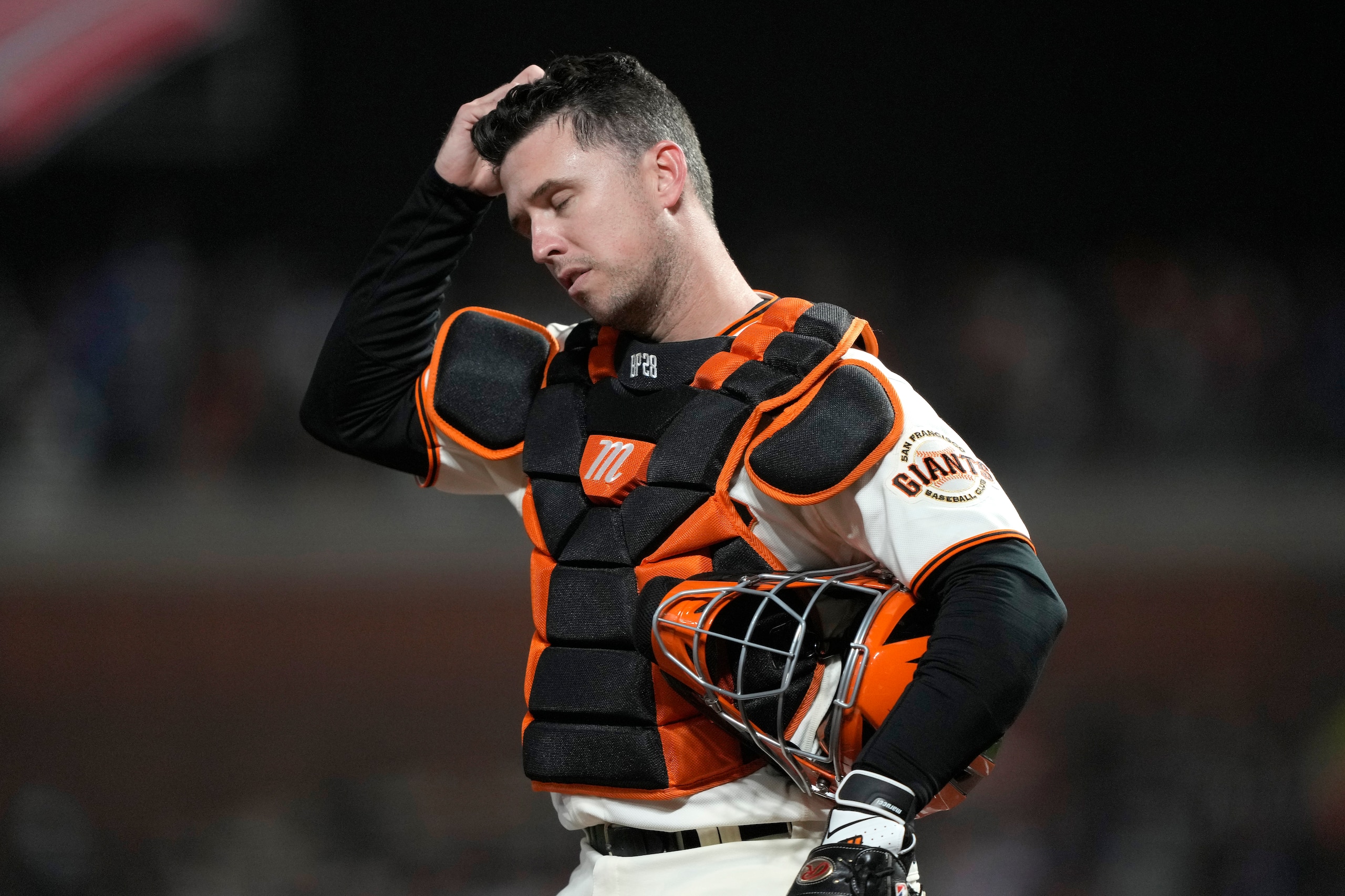 SAN FRANCISCO, CALIFORNIA - OCTOBER 14: Buster Posey #28 of the San Francisco Giants reacts after a single by Gavin Lux #9 of the Los Angeles Dodgers during the ninth inning in game 5 of the National League Division Series at Oracle Park on October 14, 2021 in San Francisco, California. (Photo by Thearon W. Henderson/Getty Images)