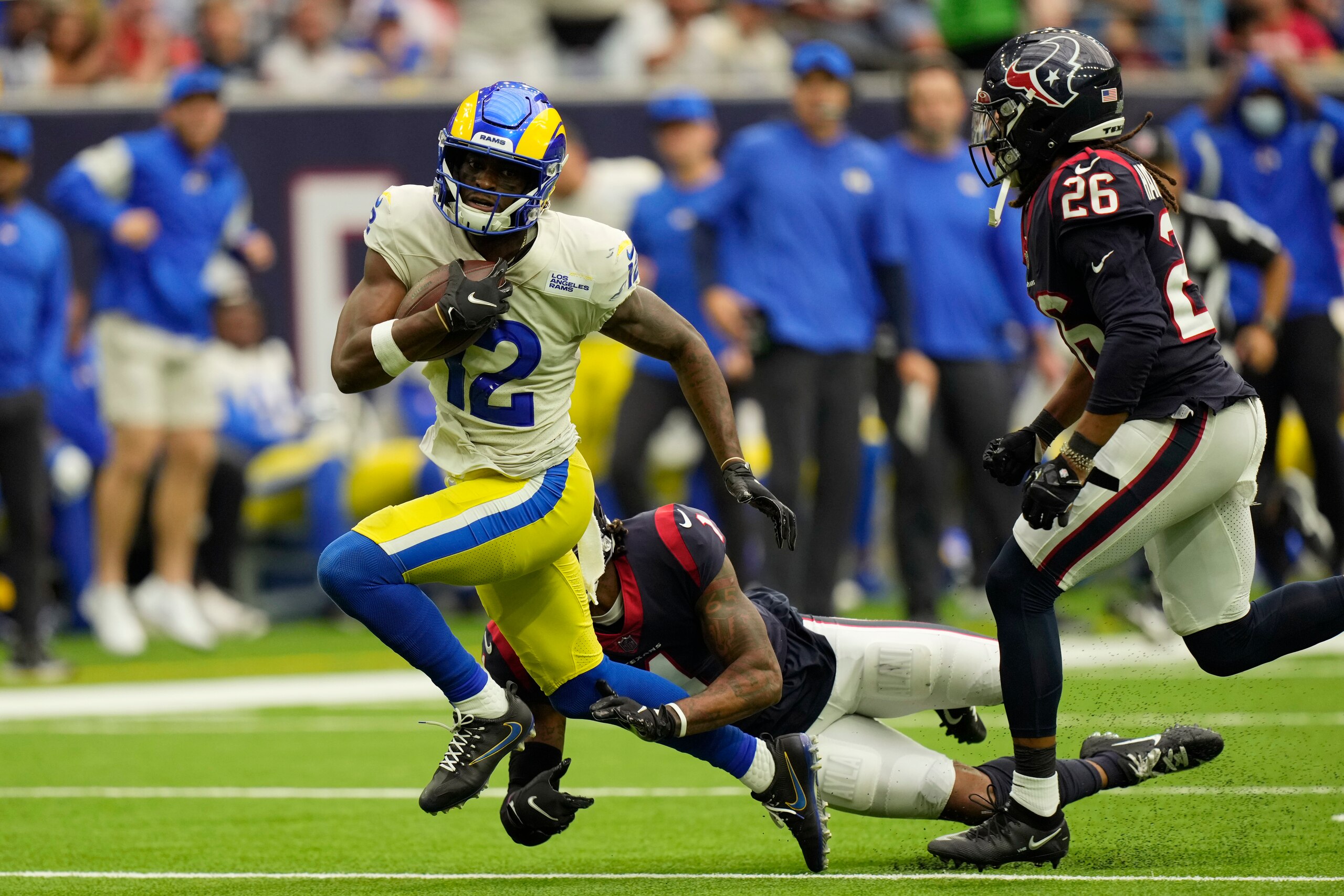 Los Angeles Rams wide receiver Van Jefferson (12) is hit by Houston Texans safety Lonnie Johnson (1) after a catch during the second half of an NFL football game, Sunday, Oct. 31, 2021, in Houston. (AP Photo/Eric Smith)