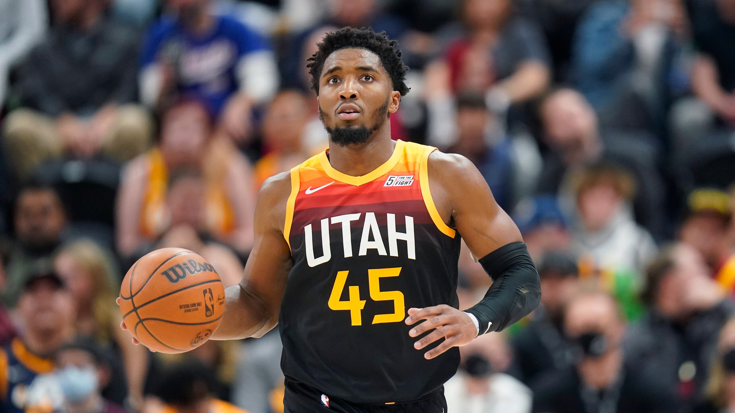 Utah Jazz guard Donovan Mitchell (45) brings the ball up court in the second half during an NBA basketball game against then Sacramento Kings Tuesday, Nov. 2, 2021, in Salt Lake City. (AP Photo/Rick Bowmer)