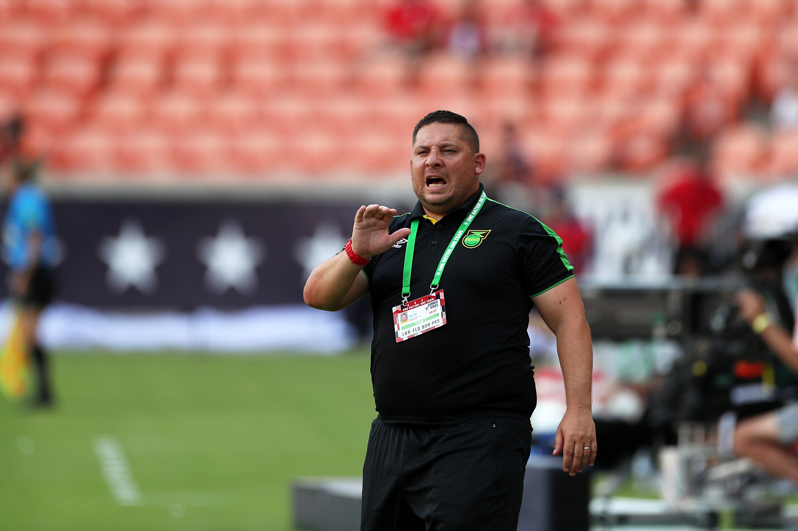HOUSTON, TX - JUNE 10: Head Coach of Jamaica Hubert Busby Jr. reacts during the Summer Series game between Jamaica and Nigeria at BBVA Stadium on June 10, 2021 in Houston, Texas. (Photo by Omar Vega/Getty Images)