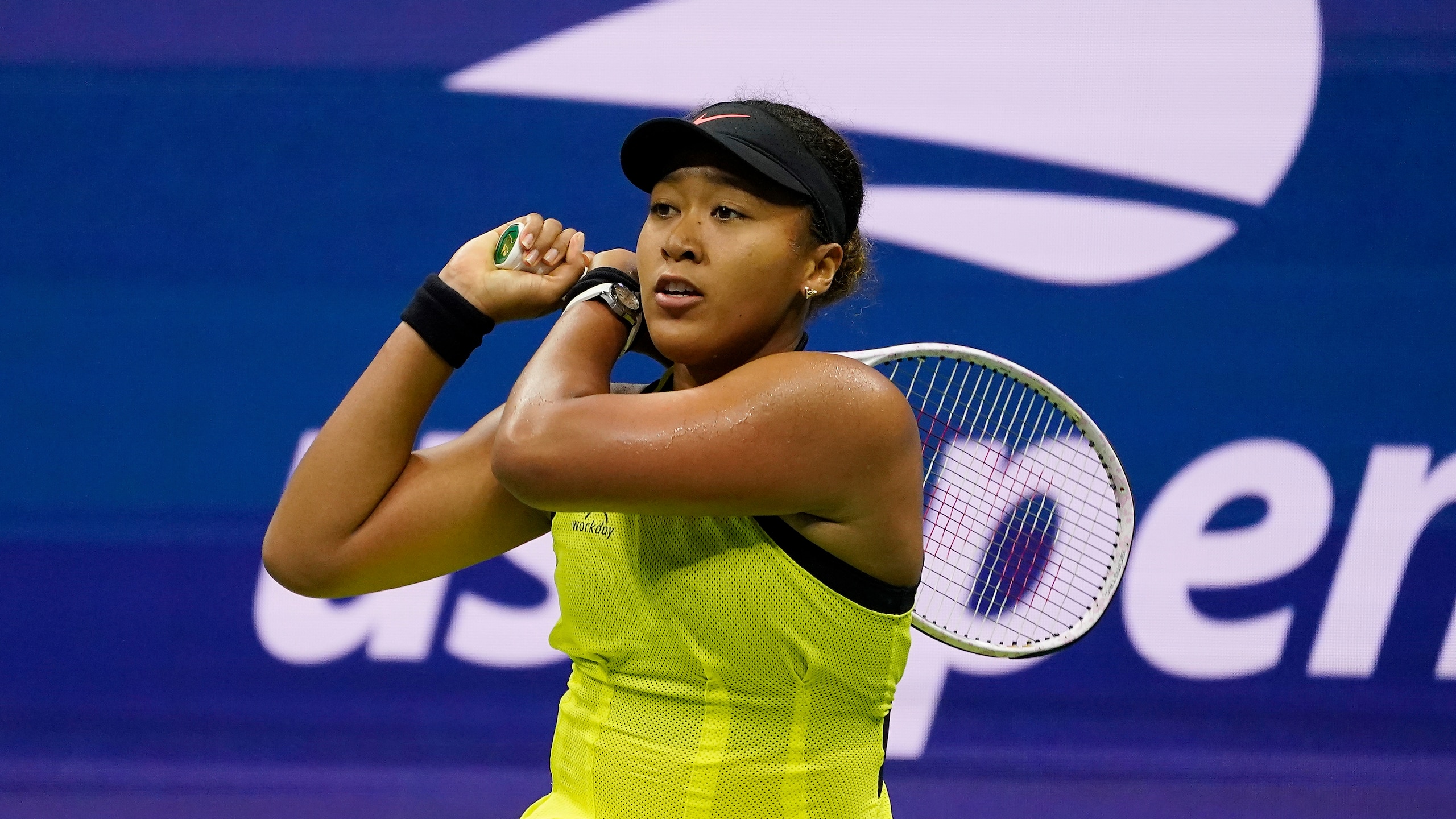 Naomi Osaka, of Japan, returns a shot to Leylah Fernandez, of Canada, during the third round of the US Open tennis championships, Friday, Sept. 3, 2021, in New York. (AP Photo/John Minchillo)