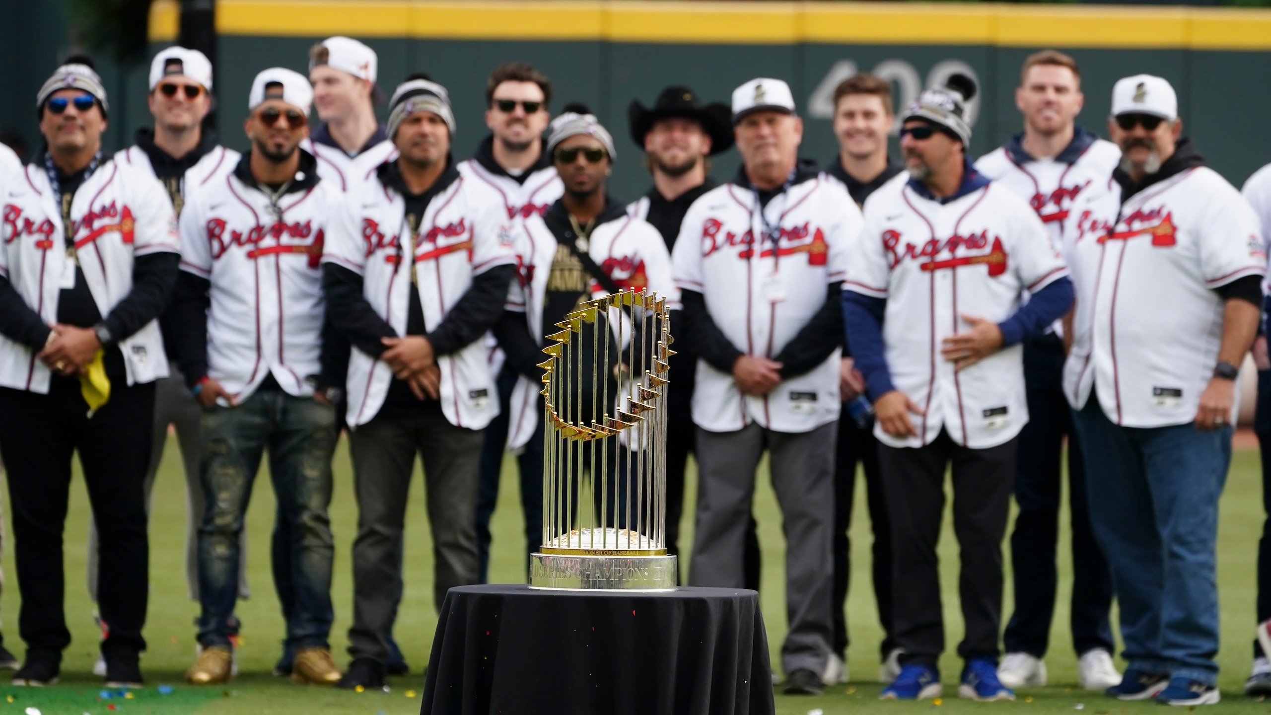 The Atlanta Braves pose with the the Commissioner's Trophy during a celebration at Truist Park, Friday, Nov. 5, 2021, in Atlanta. The Braves beat the Houston Astros 7-0 in Game 6 on Tuesday to win their first World Series MLB baseball title in 26 years. (AP Photo/John Bazemore)