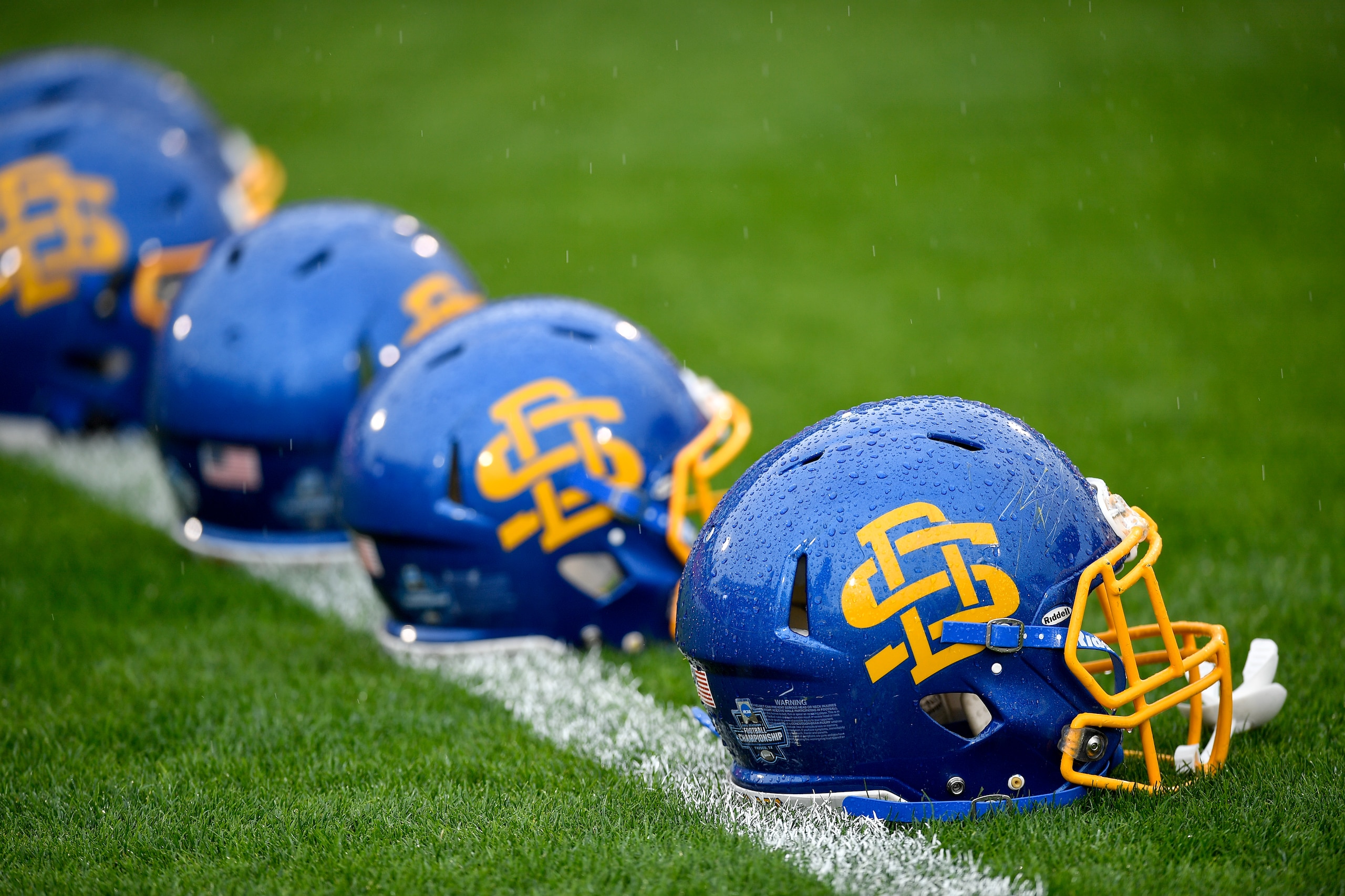 FRISCO, TX - MAY 16: The helmets of the South Dakota State Jackrabbits lay on the field before the Division I FCS Football Championship game against the Sam Houston State Bearkats held at Toyota Stadium on May 16, 2021 in Frisco, Texas. (Photo by Andy Hancock/NCAA Photos via Getty Images)