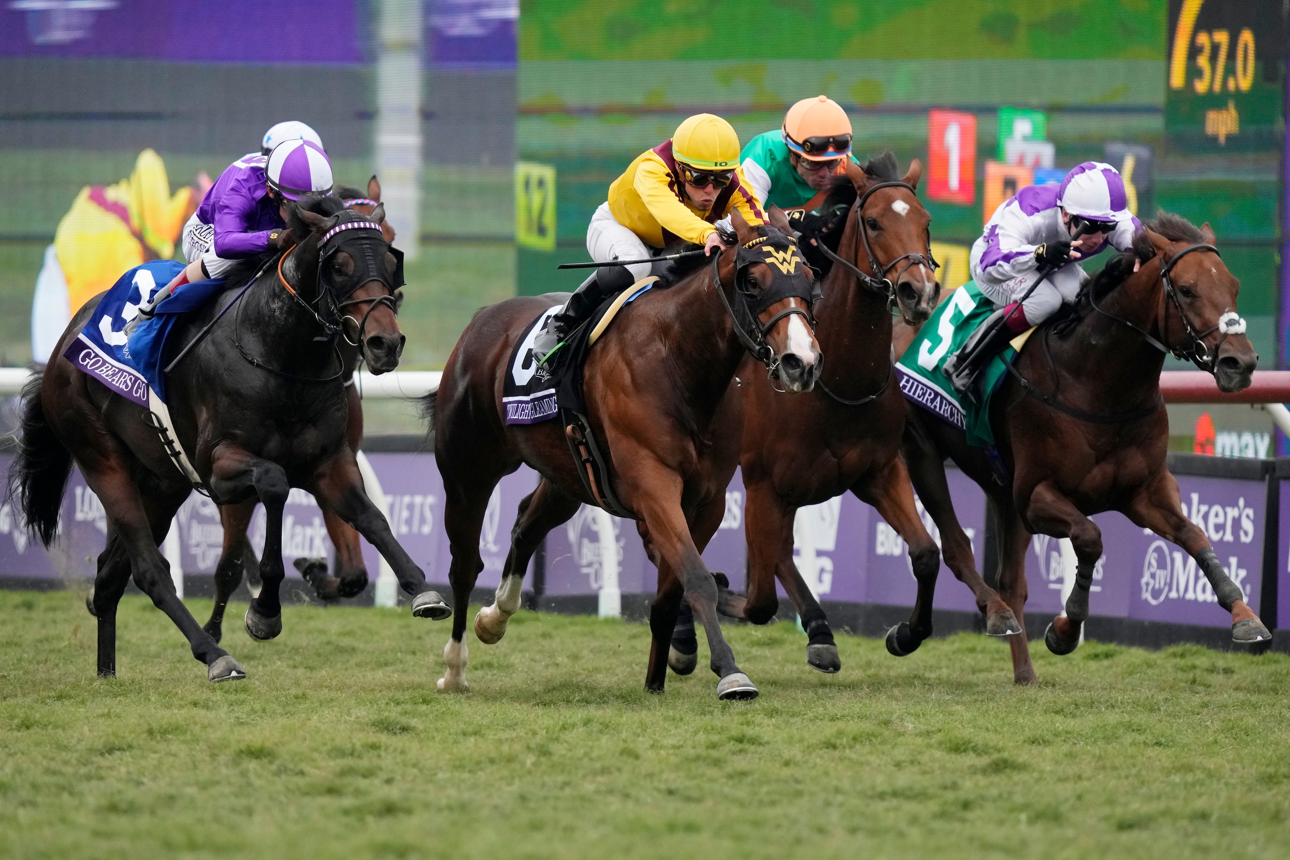 Irad Ortiz Jr., center in yellow silks, rides Twilight Gleaming to win the Breeders' Cup Juvenile Turf Sprint race at the Del Mar racetrack in Del Mar, Calif., Friday, Nov. 5, 2021. (AP Photo/Jae C. Hong)