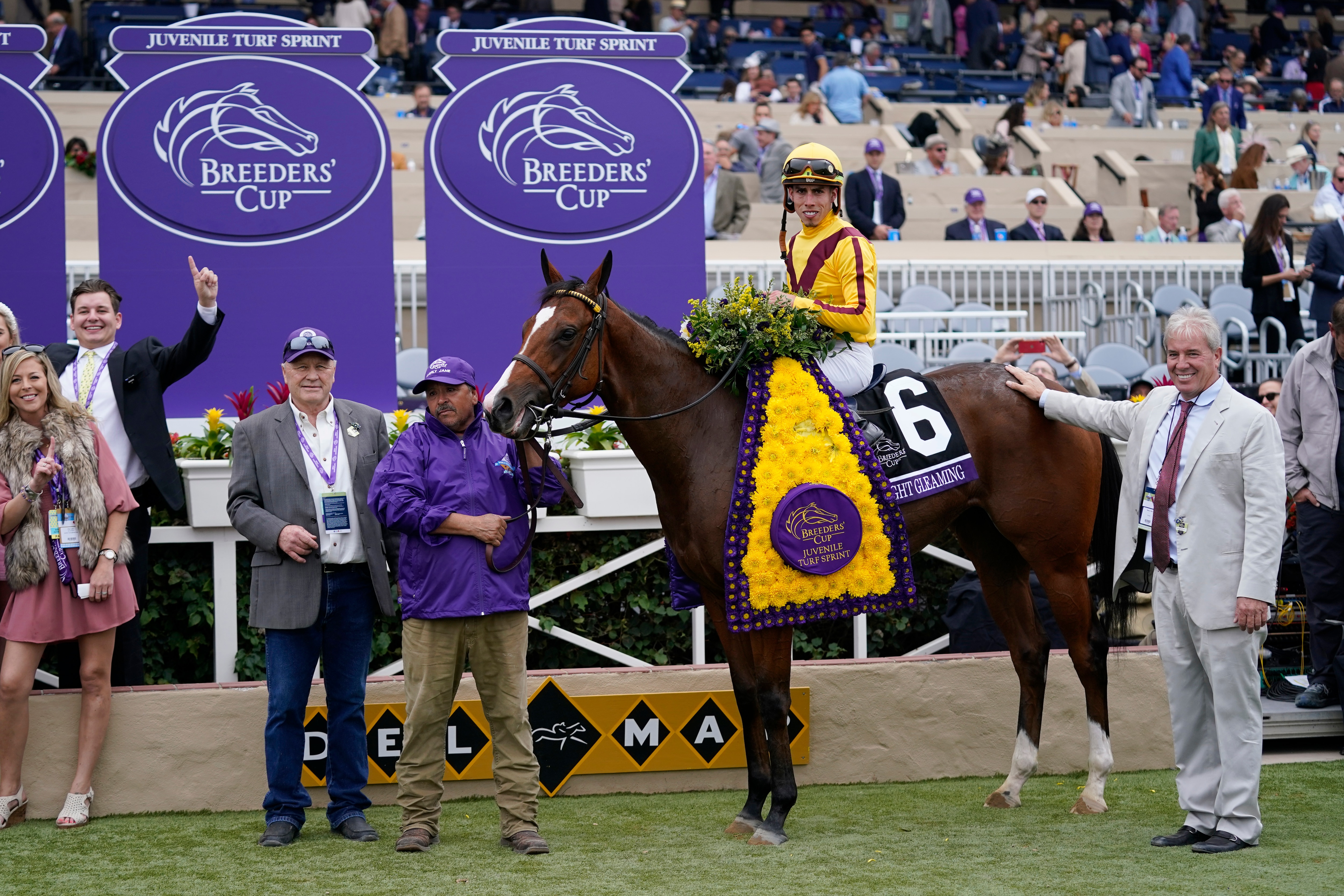 Irad Ortiz Jr. celebrates on Twilight Gleaming after winning the Breeders' Cup Juvenile Turf Sprint race at Del Mar in Del Mar, Calif., Friday, Nov. 5, 2021. (AP Photo/Jae C. Hong)