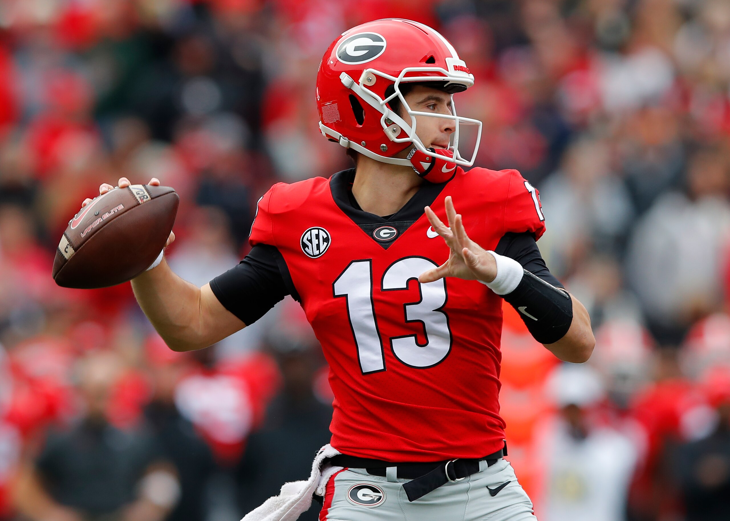 ATHENS, GA - NOVEMBER 06: Stetson Bennett #13 of the Georgia Bulldogs passes in the first half against the Missouri Tigers at Sanford Stadium on November 6, 2021 in Athens, Georgia. (Photo by Todd Kirkland/Getty Images)