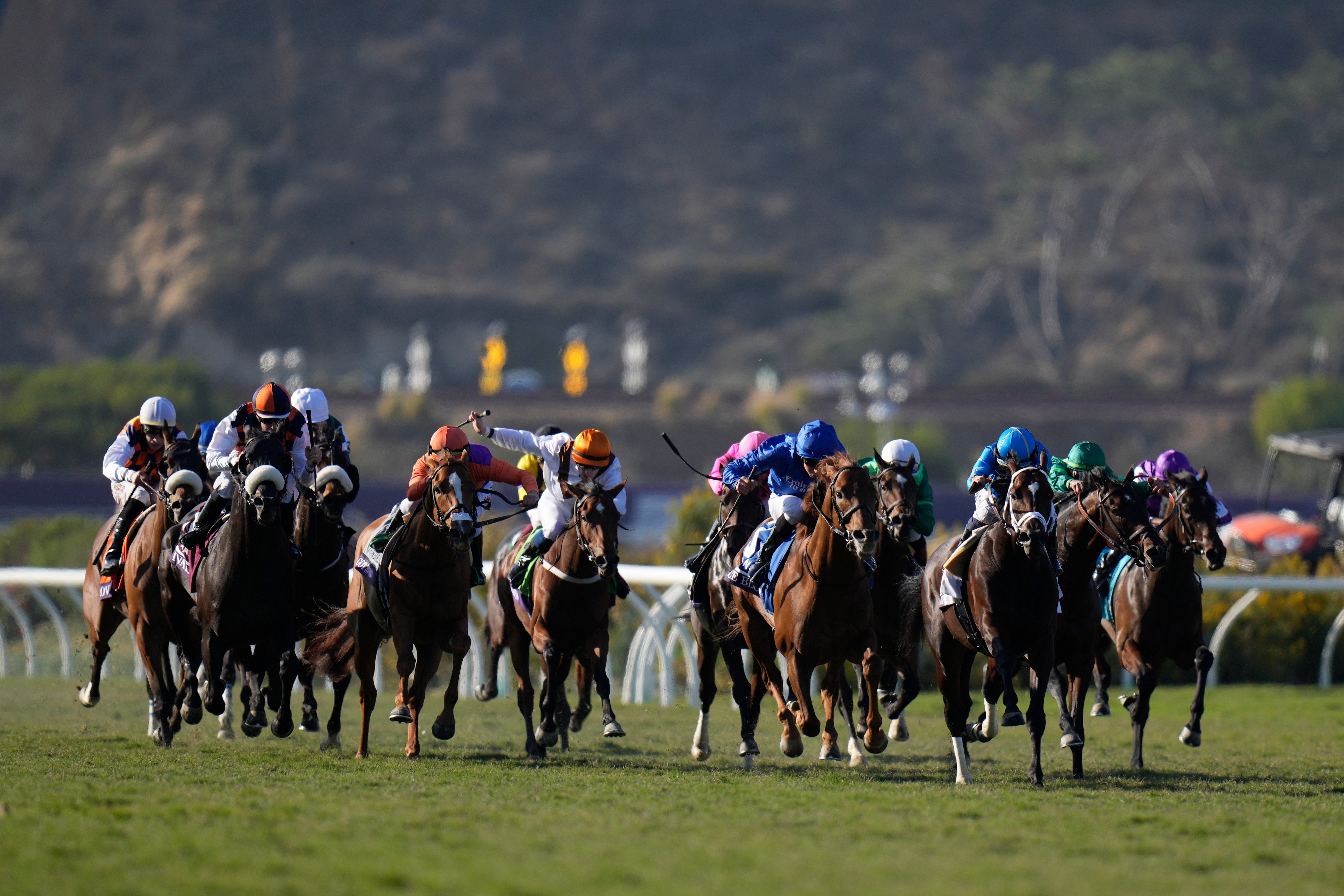 Competitors ride during the Breeders' Cup Mile race at the Del Mar racetrack in Del Mar, Calif., Saturday, Nov. 6, 2021. (AP Photo/Jae C. Hong)