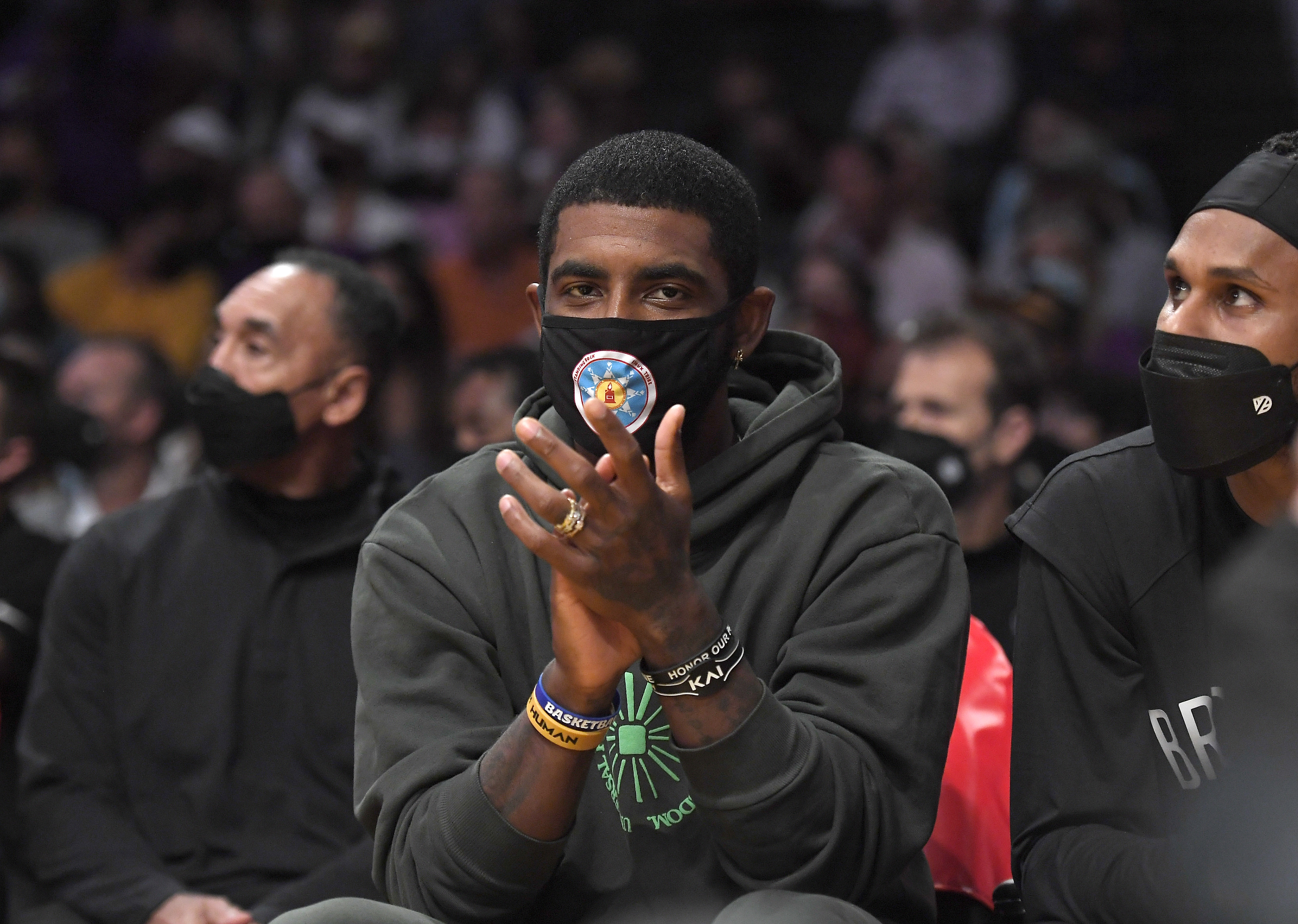 LOS ANGELES, CA - OCTOBER 03: Kyrie Irving #11 of the Brooklyn Nets cheers from the bench during a preseason game against the Los Angeles Lakers at Staples Center on October 3, 2021 in Los Angeles, California. NOTE TO USER: User expressly acknowledges and agrees that, by downloading and/or using this Photograph, user is consenting to the terms and conditions of the Getty Images License Agreement. (Photo by Kevork Djansezian/Getty Images)