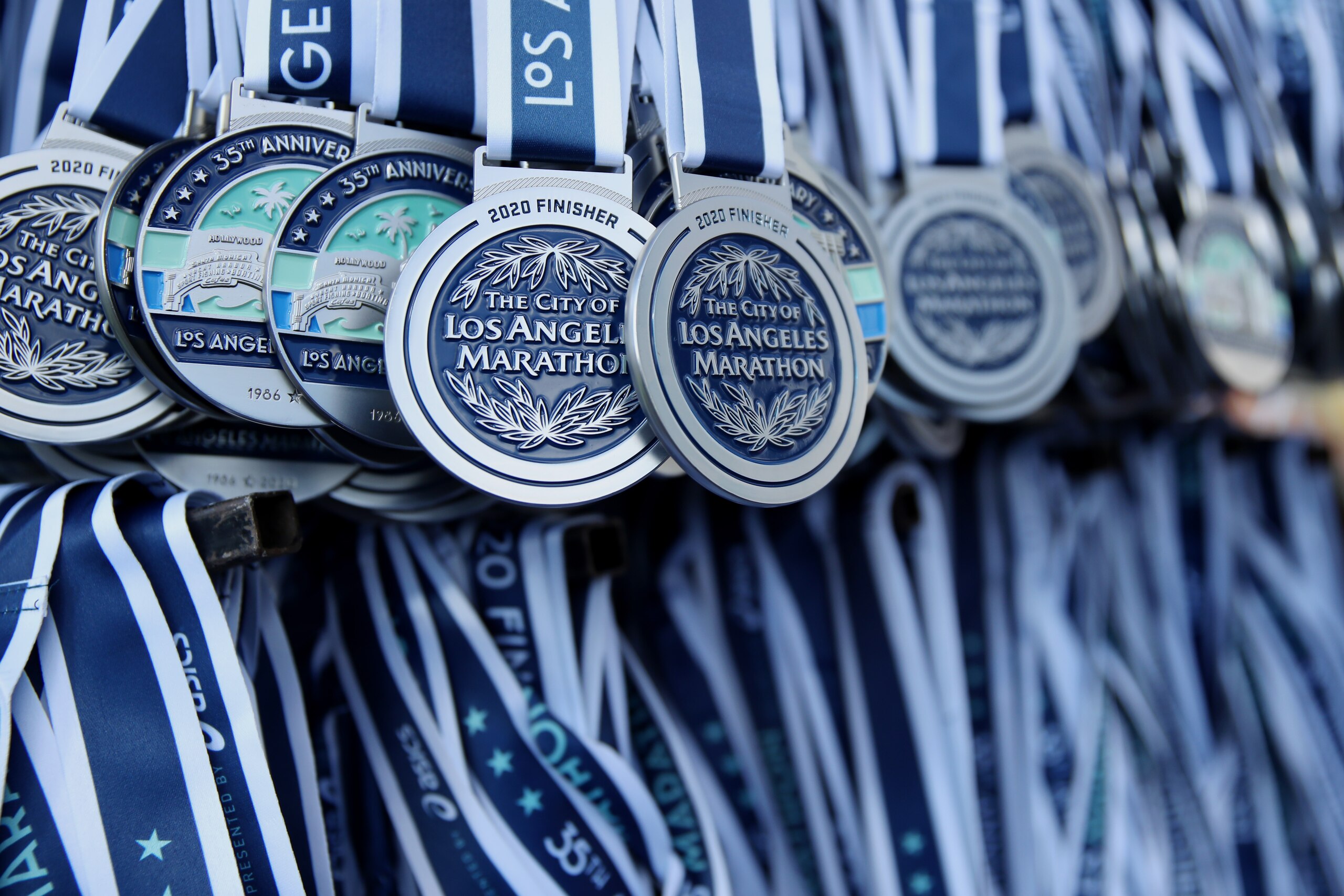 LOS ANGELES, CALIFORNIA - MARCH 08: Medals for the marathon hang during the 2020 Los Angeles Marathon on March 08, 2020 in Los Angeles, California. (Photo by Katelyn Mulcahy/Getty Images) LOS ANGELES, CALIFORNIA - MARCH 08: Medals for the marathon hang during the 2020 Los Angeles Marathon on March 08, 2020 in Los Angeles, California. (Photo by Katelyn Mulcahy/Getty Images)