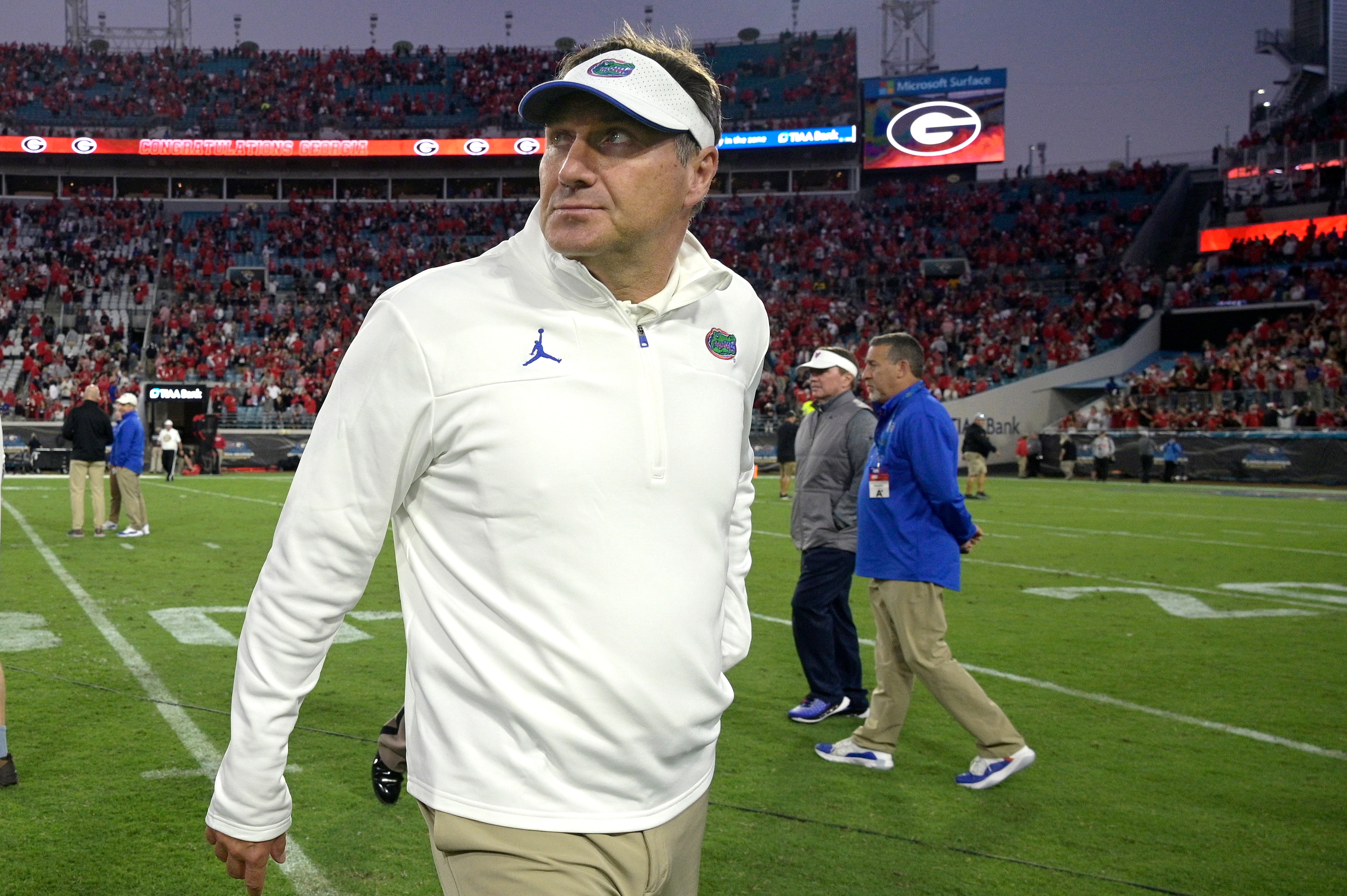 Florida head coach Dan Mullen walks off the field after a loss to Georgia in an NCAA college football game, Saturday, Oct. 30, 2021, in Jacksonville, Fla. (AP Photo/Phelan M. Ebenhack)