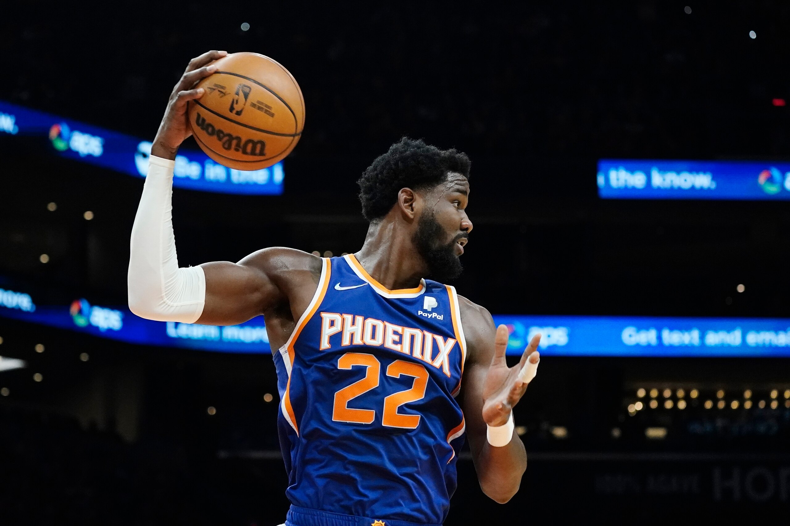 Phoenix Suns center Deandre Ayton grabs a rebound against the Cleveland Cavaliers during the first half of an NBA basketball game Saturday, Oct. 30, 2021, in Phoenix. (AP Photo/Ross D. Franklin)