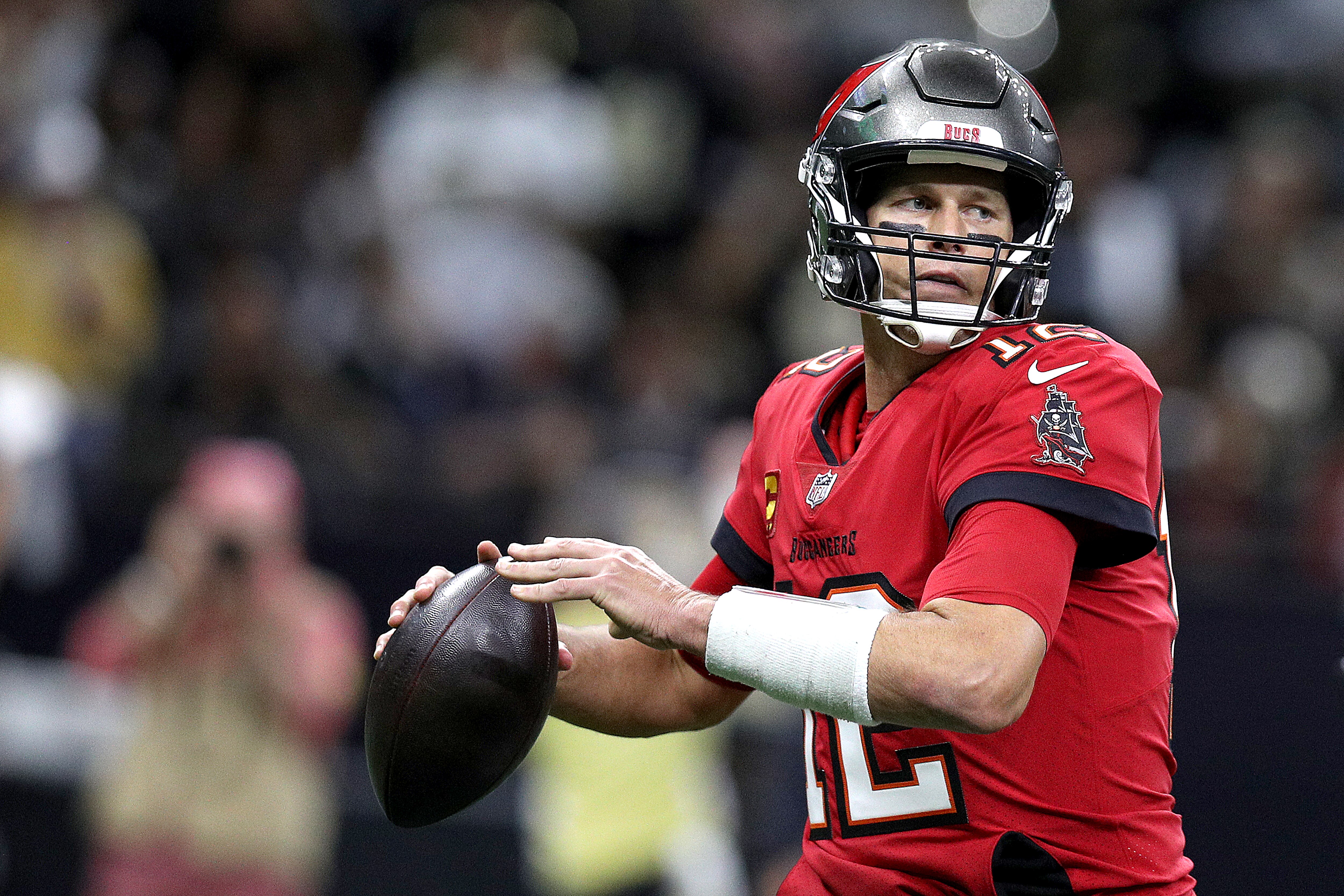 NEW ORLEANS, LOUISIANA - OCTOBER 31: Tom Brady #12 of the Tampa Bay Buccaneers looks to pass during a NFL game against the New Orleans Saints at Caesars Superdome on October 31, 2021 in New Orleans, Louisiana. (Photo by Sean Gardner/Getty Images)