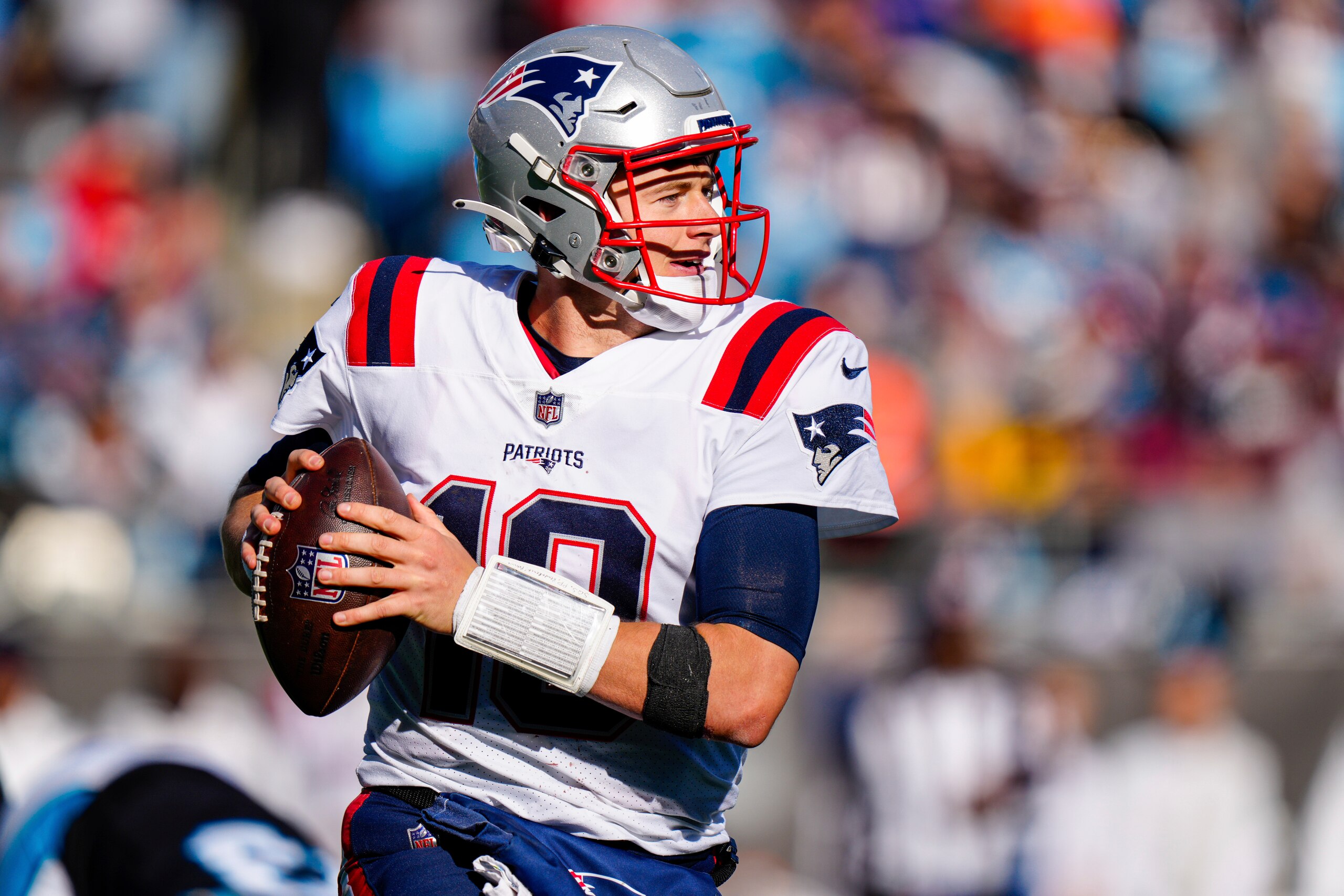 New England Patriots quarterback Mac Jones plays against the Carolina Panthers during the second half of an NFL football game Sunday, Nov. 7, 2021, in Charlotte, N.C. (AP Photo/Jacob Kupferman)