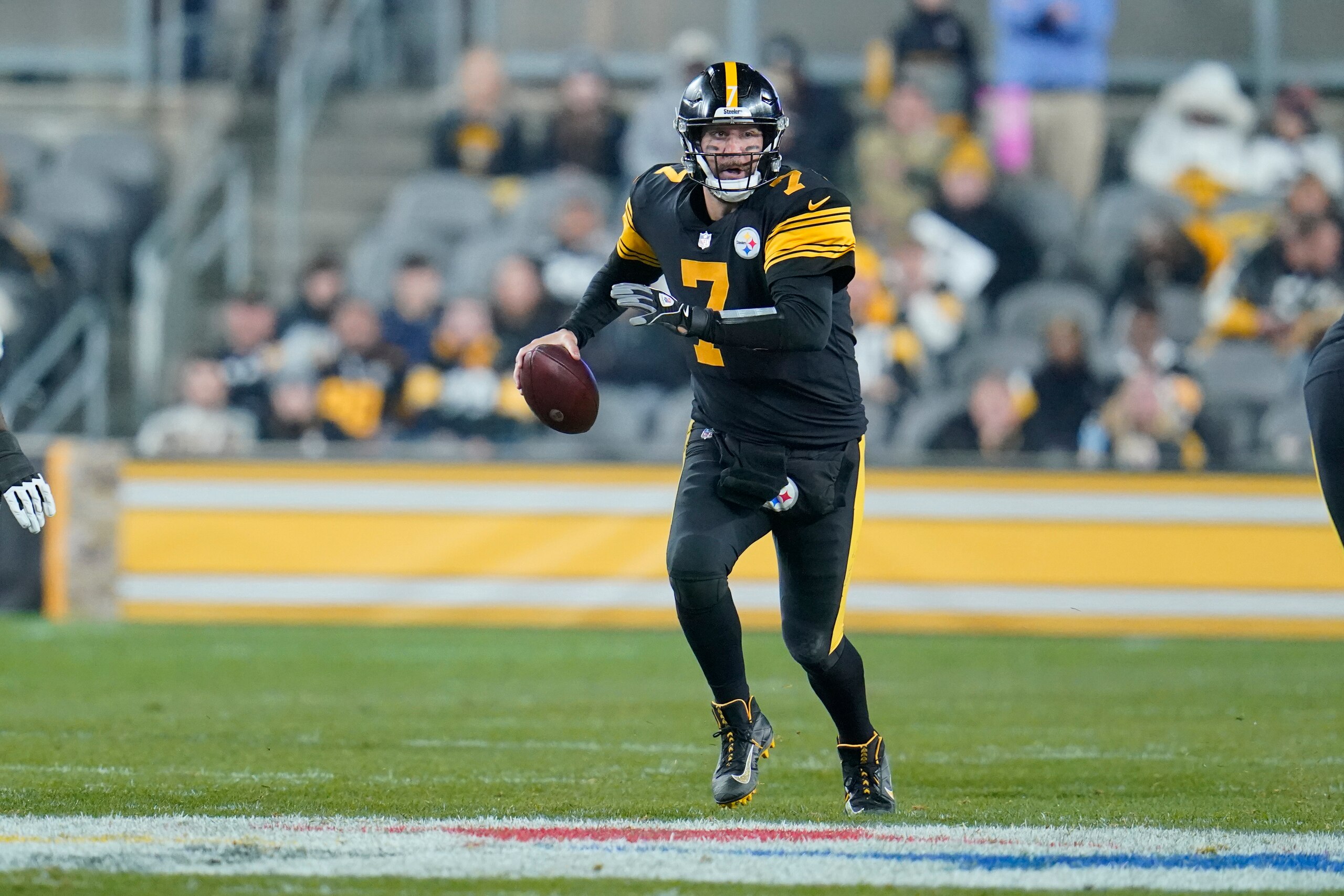 Pittsburgh Steelers quarterback Ben Roethlisberger (7) scrambles before passing against the Chicago Bears during the second half of an NFL football game, Monday, Nov. 8, 2021, in Pittsburgh. (AP Photo/Gene J. Puskar)