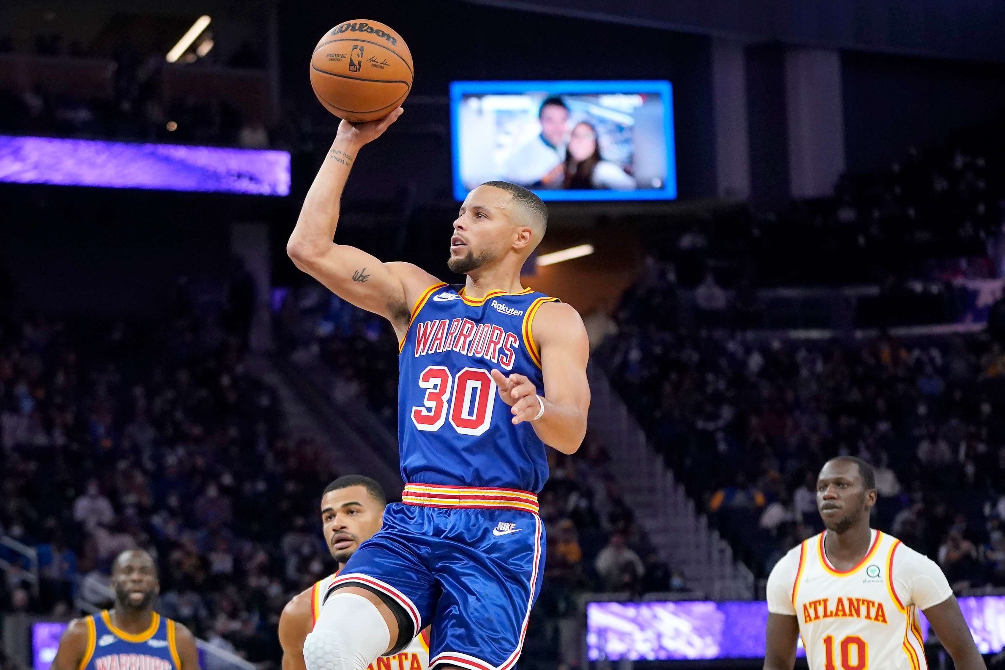 Golden State Warriors guard Stephen Curry (30) shoots against the Atlanta Hawks during the second half of an NBA basketball game in San Francisco, Monday, Nov. 8, 2021. (AP Photo/Jeff Chiu)