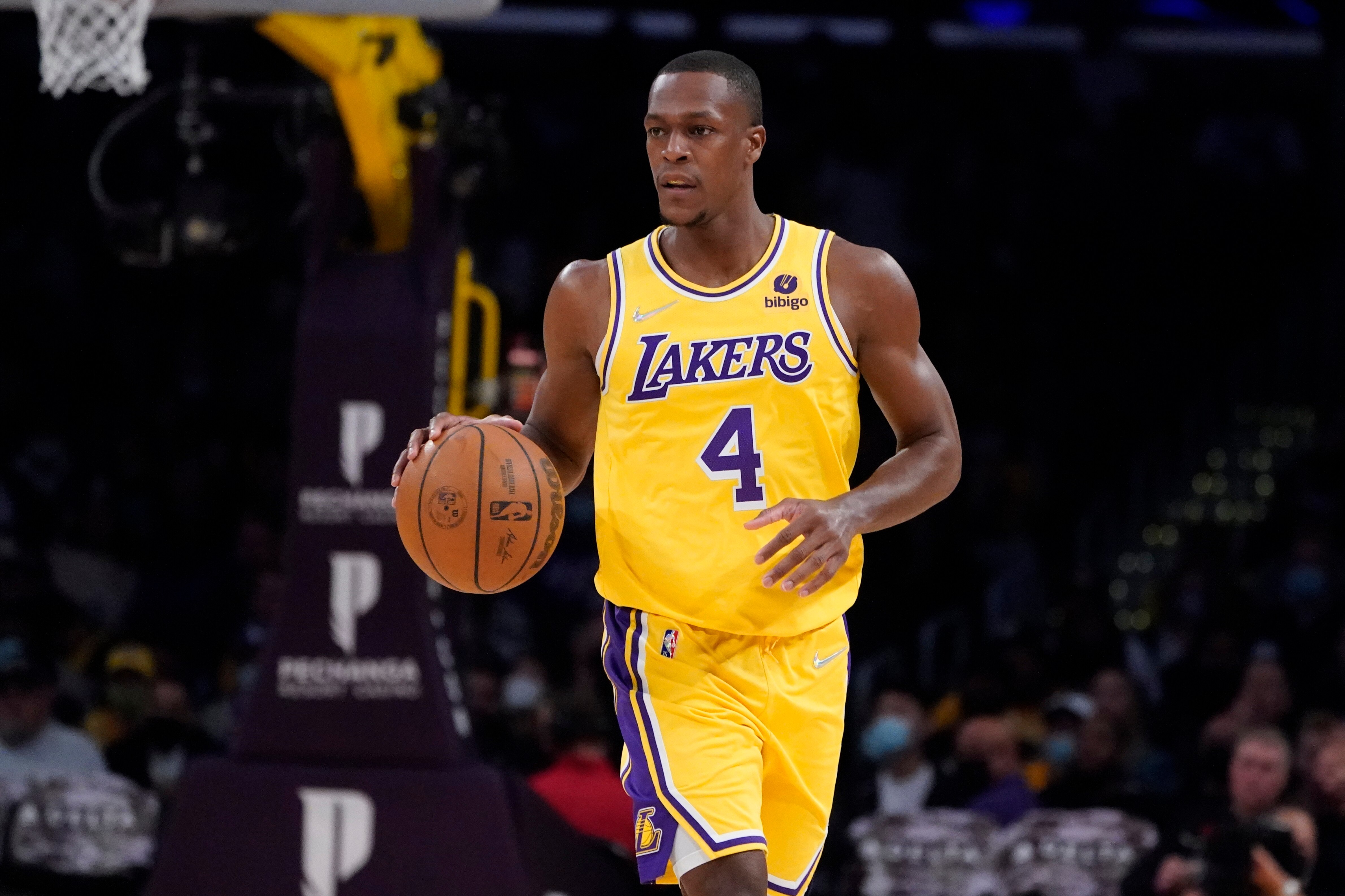 Los Angeles Lakers guard Rajon Rondo (4) dribbles during the first half of an NBA basketball game against the Oklahoma City Thunder Thursday, Nov. 4, 2021, in Los Angeles. (AP Photo/Marcio Jose Sanchez)
