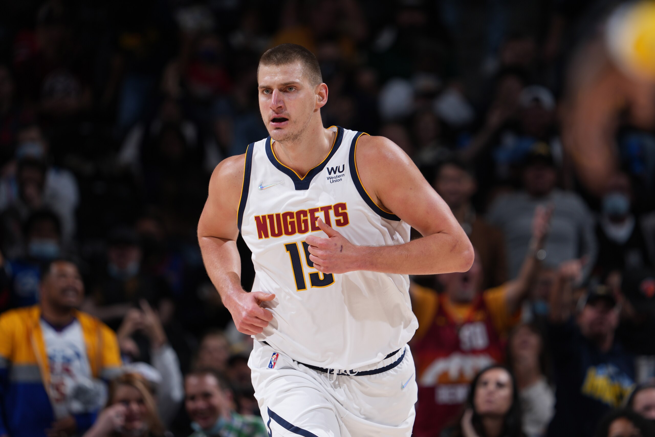 DENVER, CO - NOVEMBER 8: Nikola Jokic #15 of the Denver Nuggets runs on during a game against the Miami Heat on November 8, 2021 at the Ball Arena in Denver, Colorado. NOTE TO USER: User expressly acknowledges and agrees that, by downloading and/or using this Photograph, user is consenting to the terms and conditions of the Getty Images License Agreement. Mandatory Copyright Notice: Copyright 2021 NBAE (Photo by Bart Young/NBAE via Getty Images)