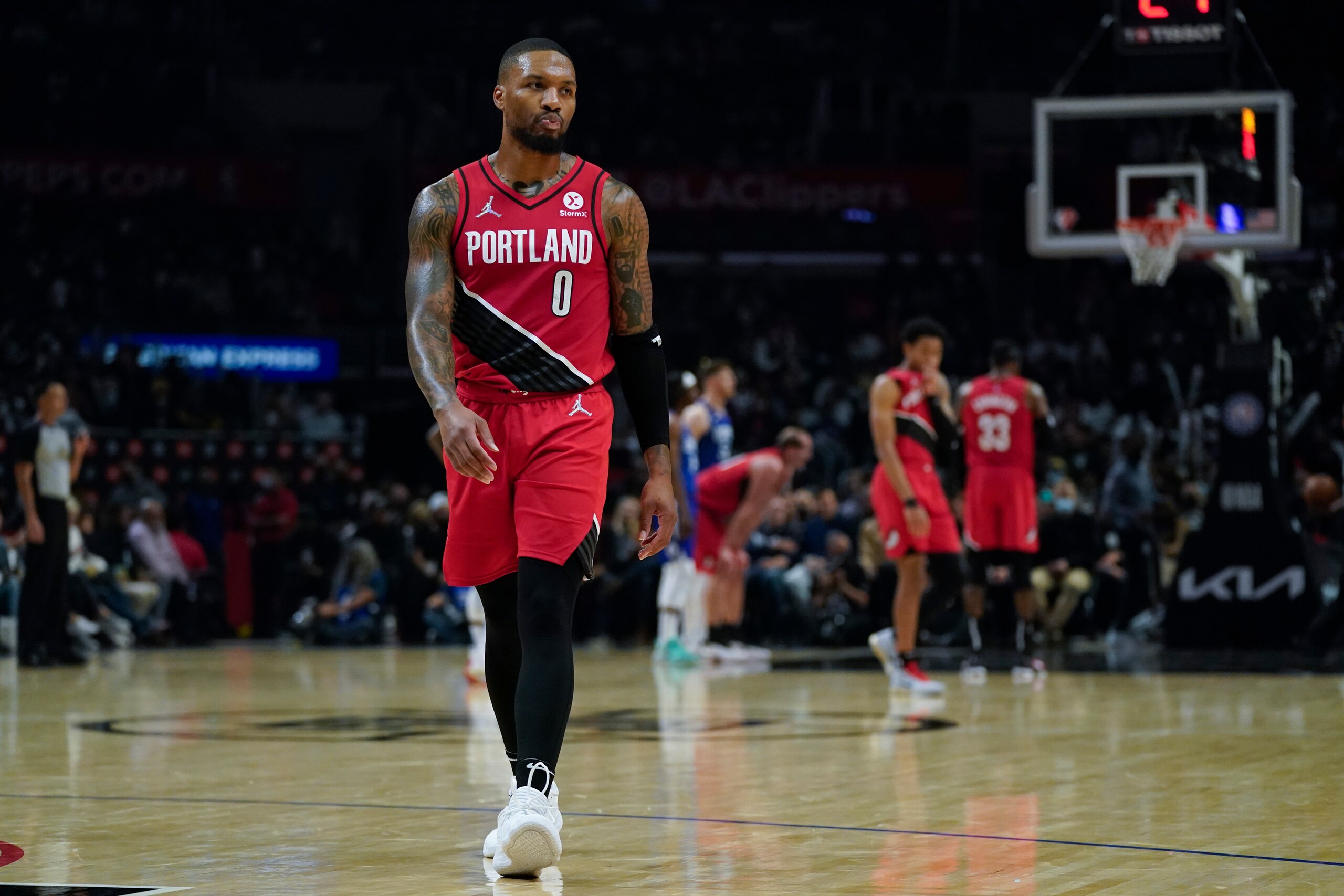 Portland Trail Blazers guard Damian Lillard (0) reacts after a foul call during the second half of an NBA basketball game against the Los Angeles Clippers in Los Angeles, Tuesday, Nov. 9, 2021. (AP Photo/Ashley Landis)