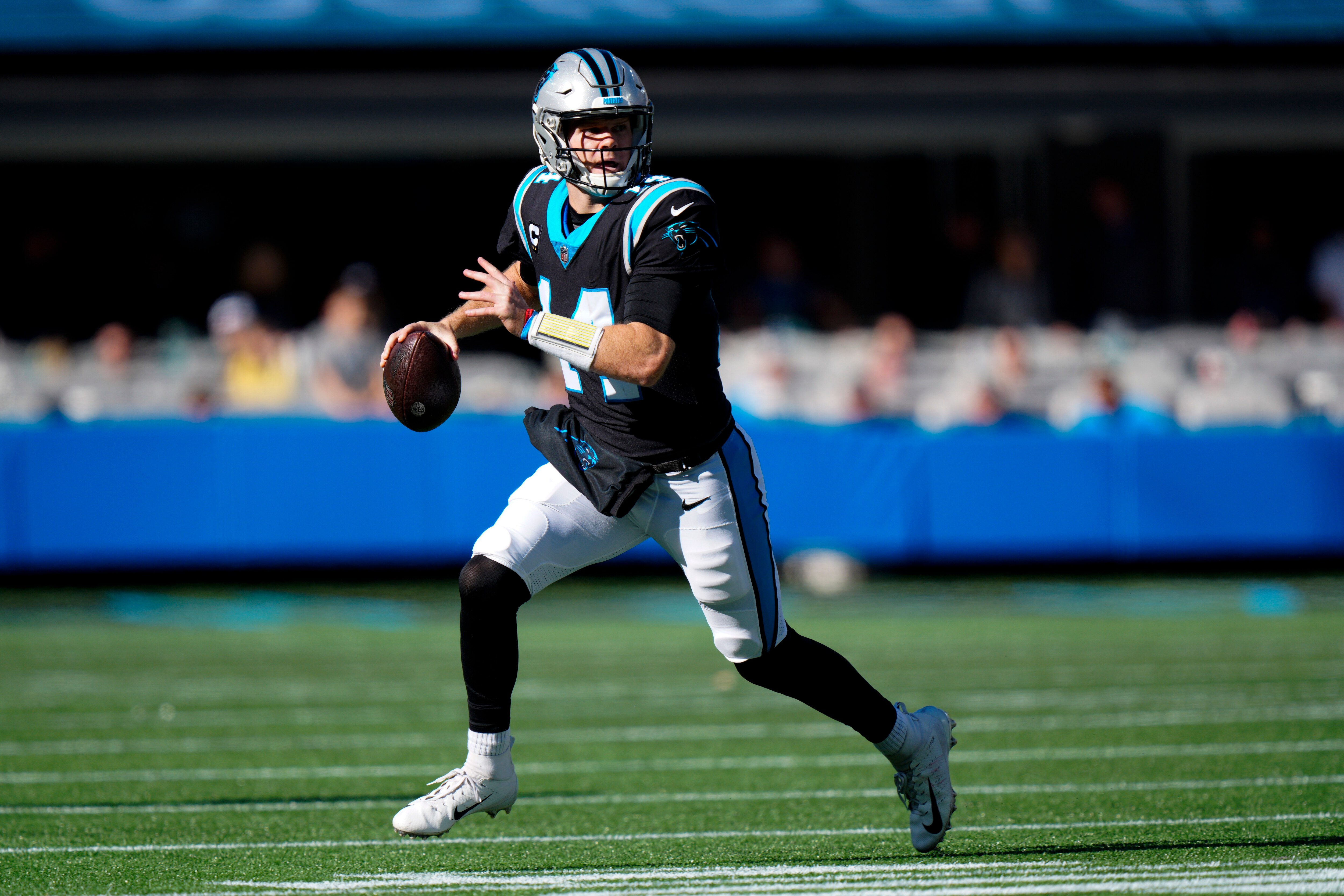 Carolina Panthers quarterback Sam Darnold plays against the New England Patriots during the first half of an NFL football game Sunday, Nov. 7, 2021, in Charlotte, N.C. (AP Photo/Jacob Kupferman)