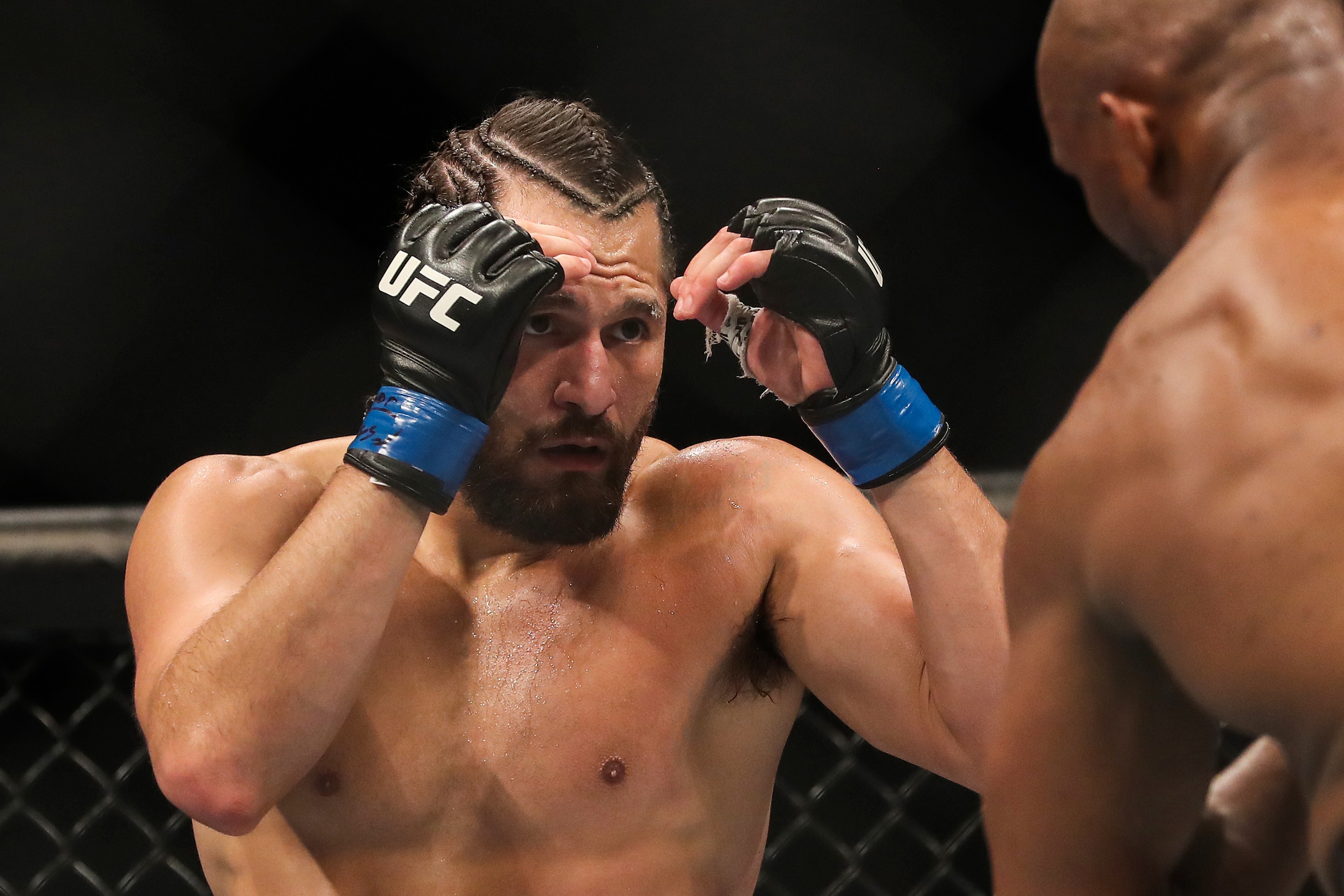 JACKSONVILLE, FL - APRIL 25: Jorge Masvidal of the United States holds his hands up against Kamaru Usman of Nigera during the Welterweight Title bout of UFC 261 at VyStar Veterans Memorial Arena on April 25, 2021 in Jacksonville, Florida.  (Photo by Alex Menendez/Getty Images)