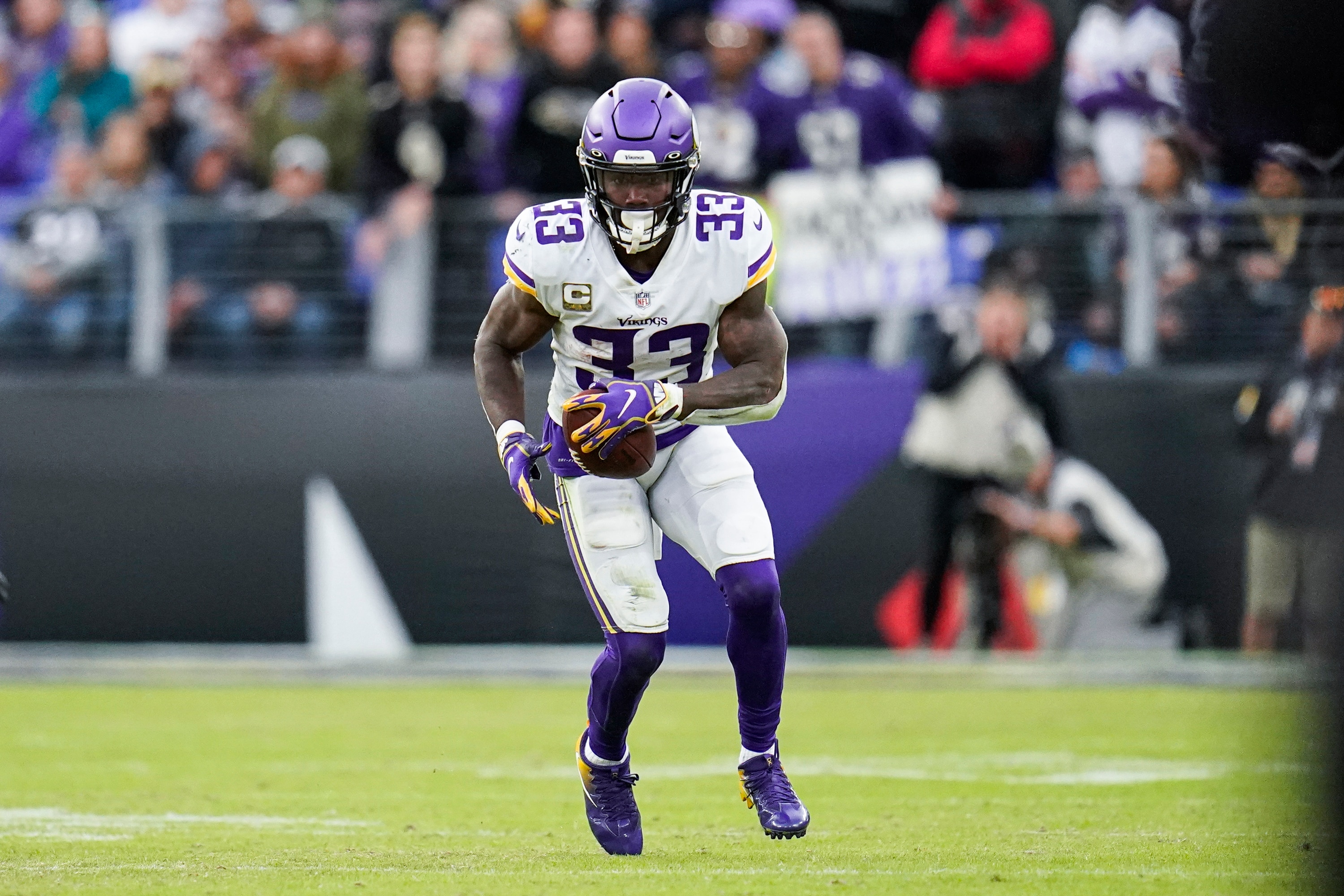 Minnesota Vikings running back Dalvin Cook runs with the ball against the Baltimore Ravens during overtime of an NFL football game, Sunday, Nov. 7, 2021, in Baltimore. The Ravens won 34-31 in overtime. (AP Photo/Julio Cortez)