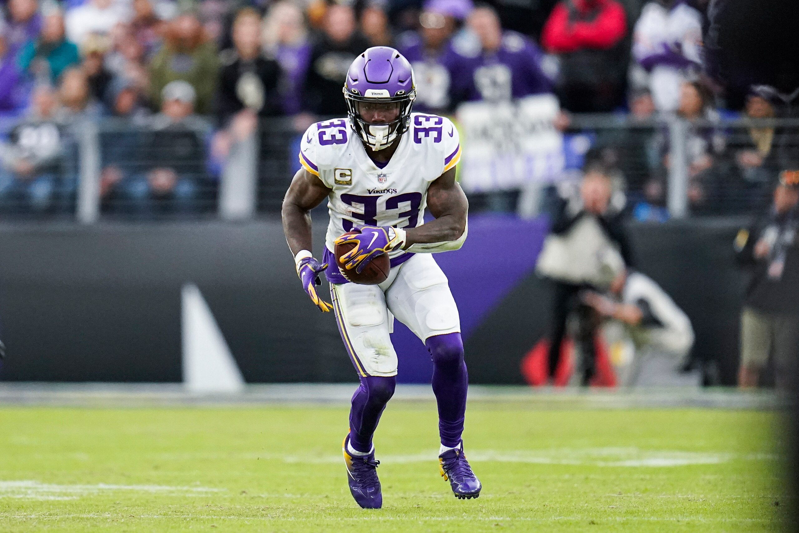 Minnesota Vikings running back Dalvin Cook runs with the ball against the Baltimore Ravens during overtime of an NFL football game, Sunday, Nov. 7, 2021, in Baltimore. The Ravens won 34-31 in overtime. (AP Photo/Julio Cortez)