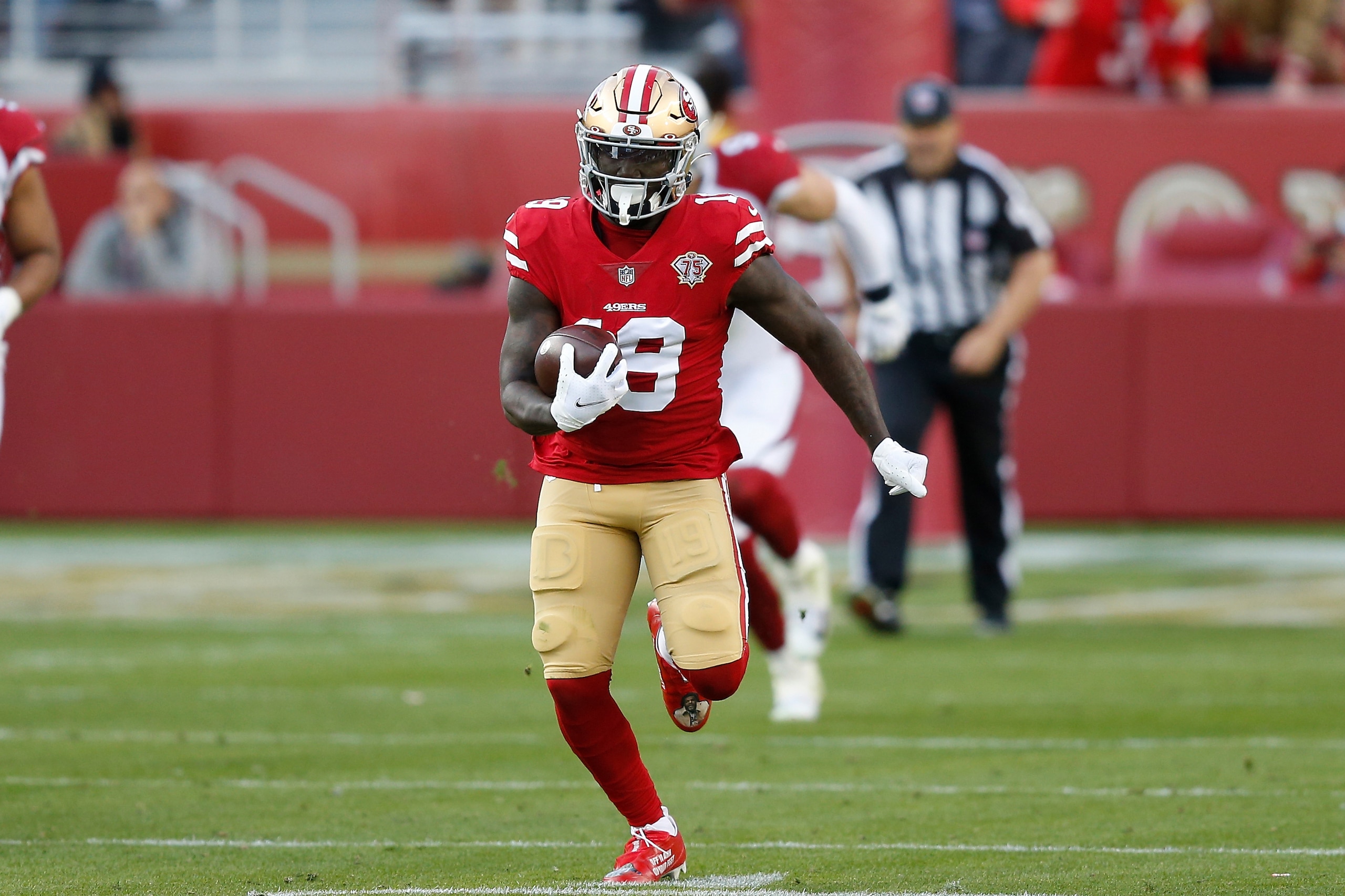 San Francisco 49ers wide receiver Deebo Samuel (19) runs with the ball after a catch in the third quarter against the Arizona Cardinals during an NFL football game, Sunday, Nov. 7, 2021 in Santa Clara, Calif. (AP Photo/Lachlan Cunningham)