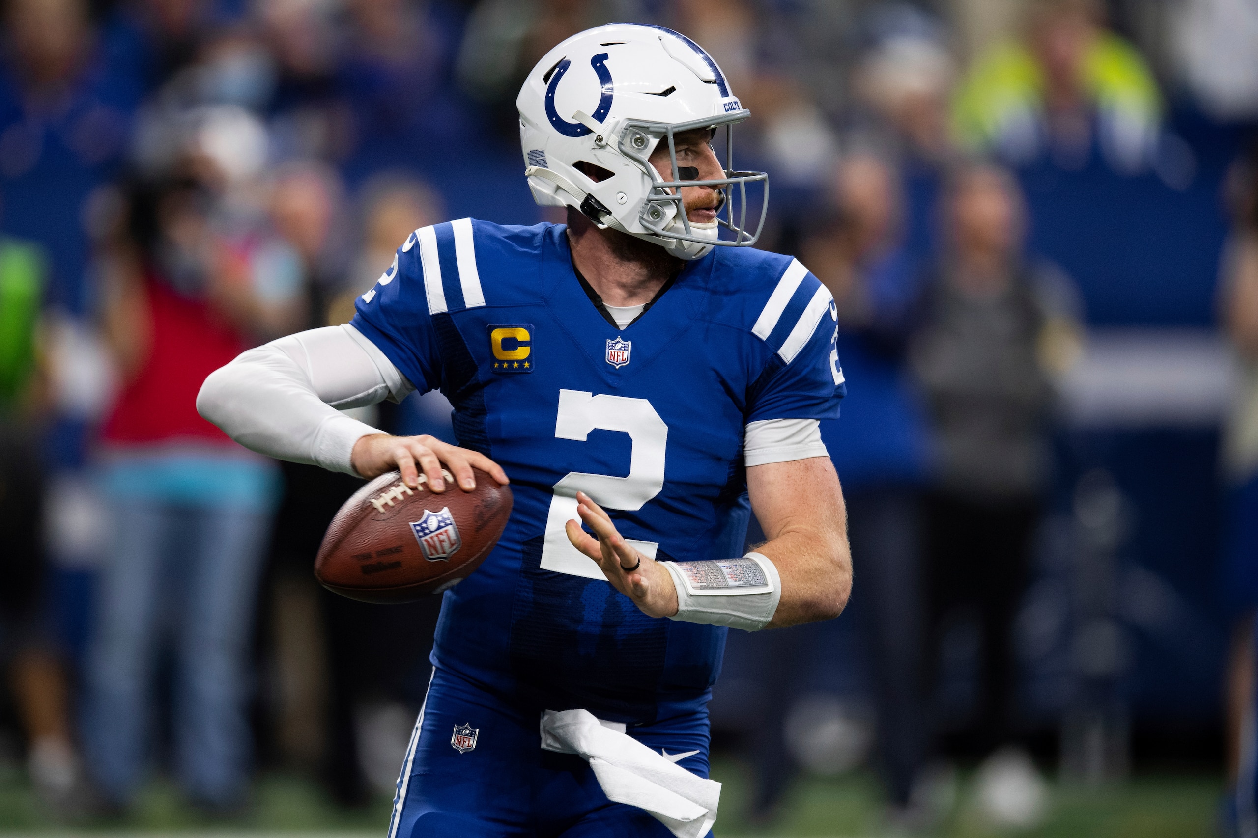 Indianapolis Colts quarterback Carson Wentz (2) rolls to the outside looking for an open receiver during an NFL football game against the New York Jets, Thursday, Nov. 4, 2021, in Indianapolis. (AP Photo/Zach Bolinger)