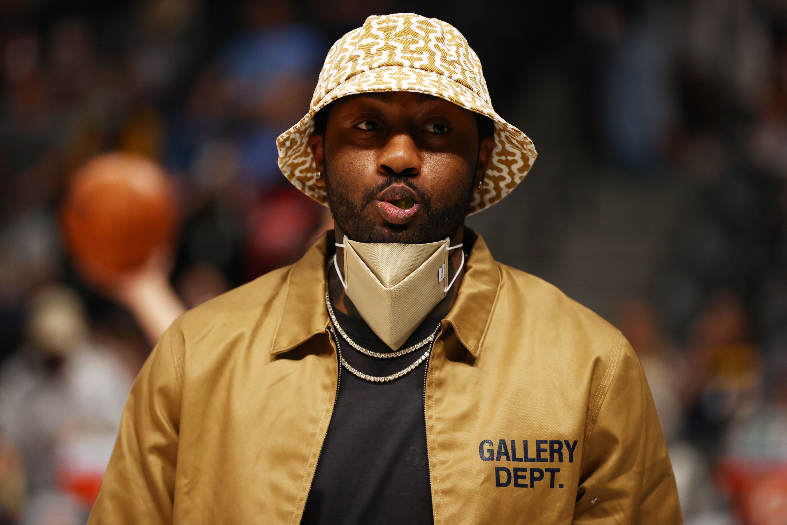 DENVER, CO - NOVEMBER 06: John Wall #1 of the Houston Rockets watches warm ups from the sidelines against the Denver Nuggets at Ball Arena on November 6, 2021 in Denver, Colorado. NOTE TO USER: User expressly acknowledges and agrees that, by downloading and or using this photograph, User is consenting to the terms and conditions of the Getty Images License Agreement. (Photo by Jamie Schwaberow/Getty Images)"n