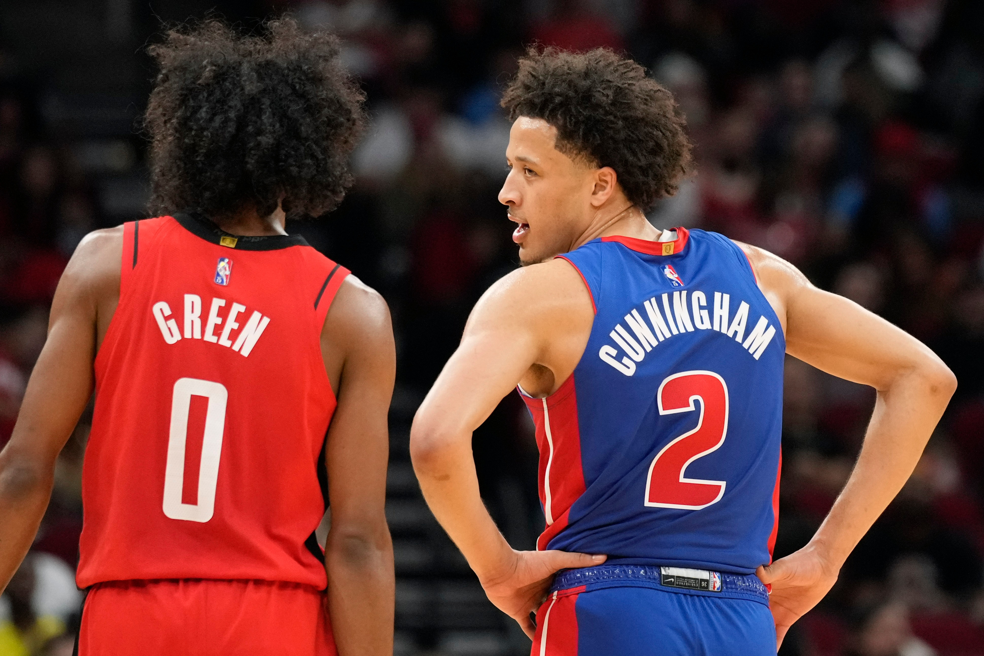Detroit Pistons guard Cade Cunningham (2) glances at Houston Rockets guard Jalen Green during the second half of an NBA basketball game, Wednesday, Nov. 10, 2021, in Houston. (AP Photo/Eric Christian Smith)