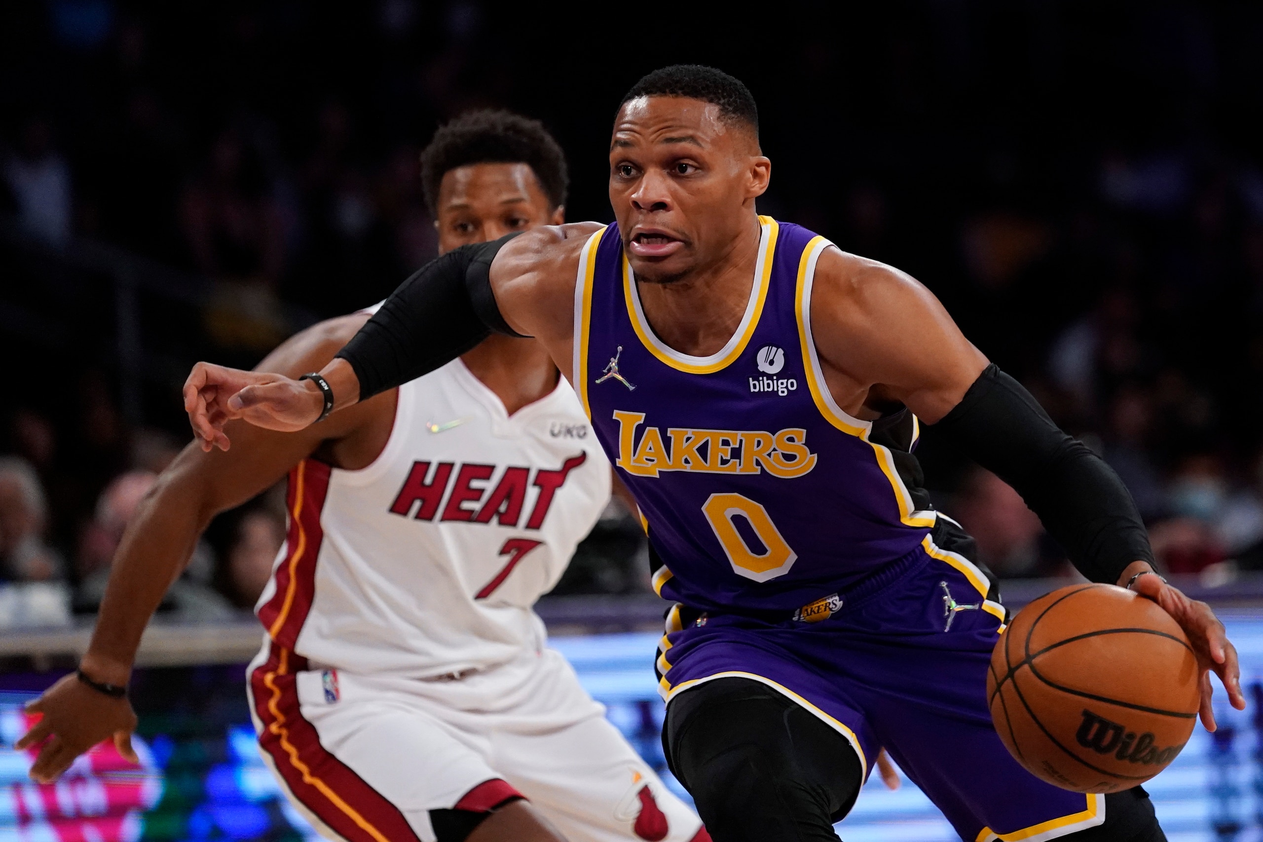 Los Angeles Lakers guard Russell Westbrook (0) drives to the hoop against Miami Heat guard Kyle Lowry (7) during the first half of an NBA basketball game in Los Angeles, Wednesday, Nov. 10, 2021. (AP Photo/Ashley Landis)