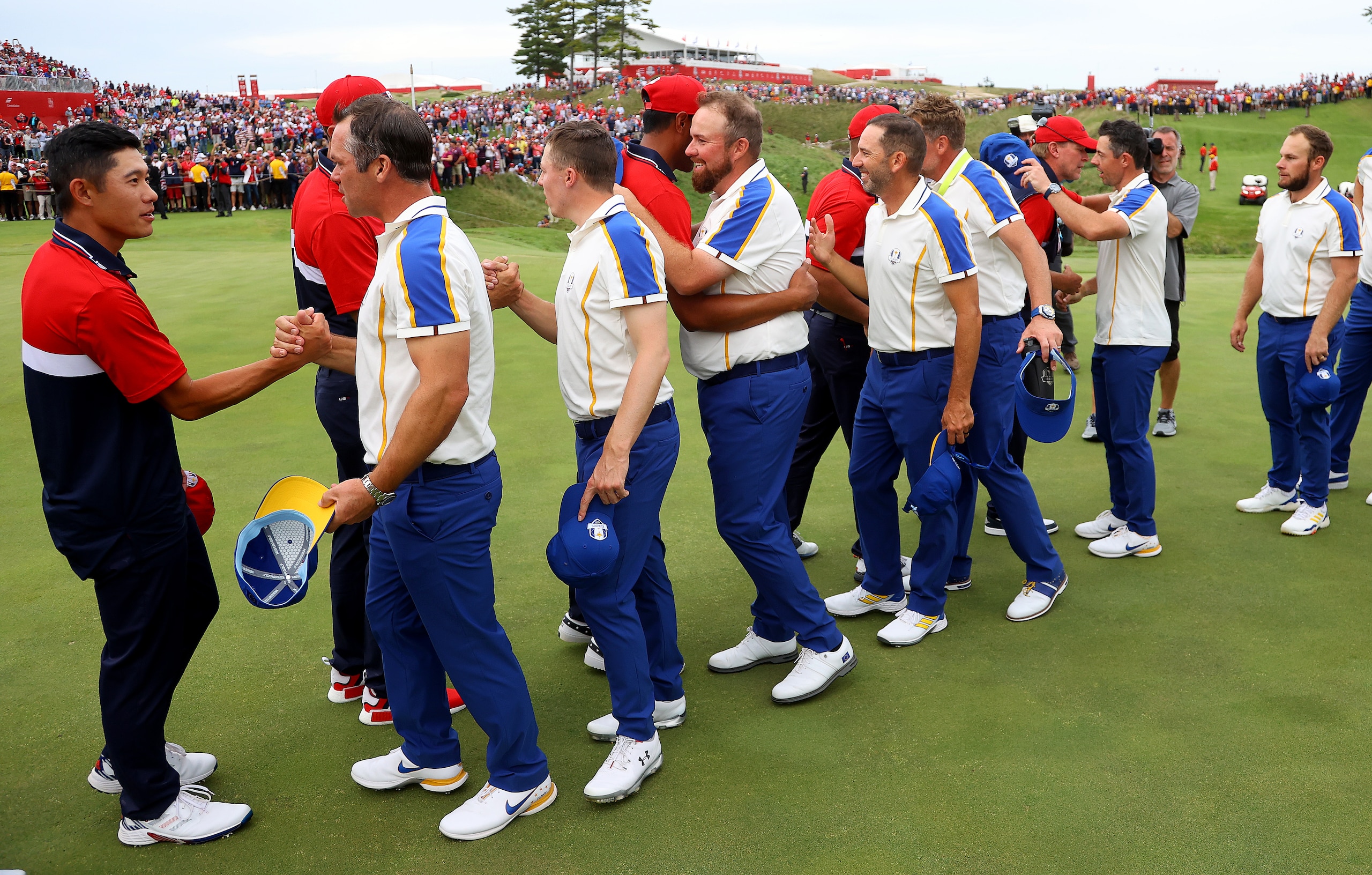 KOHLER, WISCONSIN - SEPTEMBER 26: European players congratulate the USA Team at Whistling Straits on September 26, 2021 in Kohler, Wisconsin. (Photo by Andrew Redington/Getty Images)