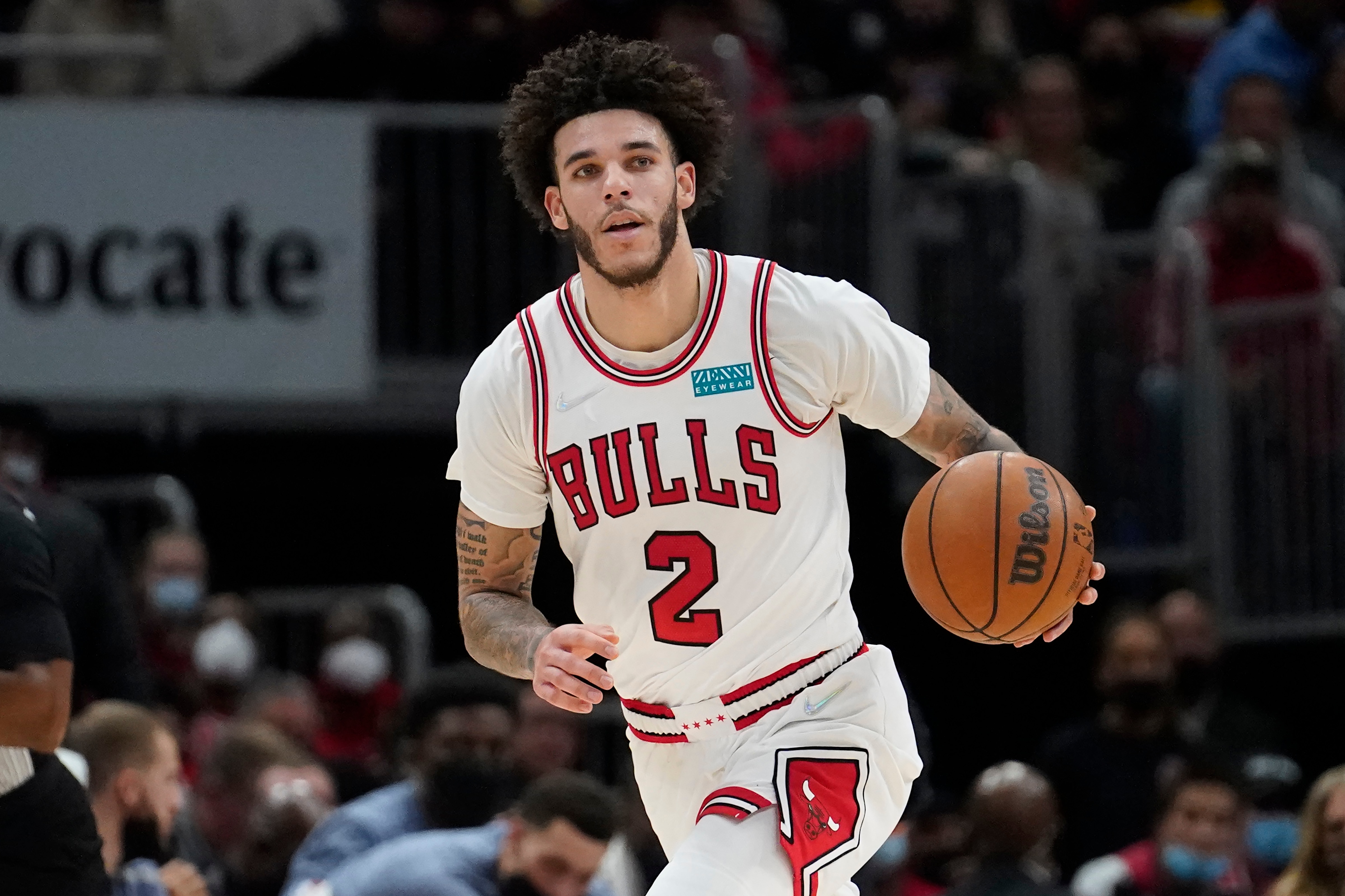 Chicago Bulls' Lonzo Ball advances the ball in an NBA basketball game against the Philadelphia 76ers Saturday, Nov. 6, 2021, in Chicago. (AP Photo/Charles Rex Arbogast)
