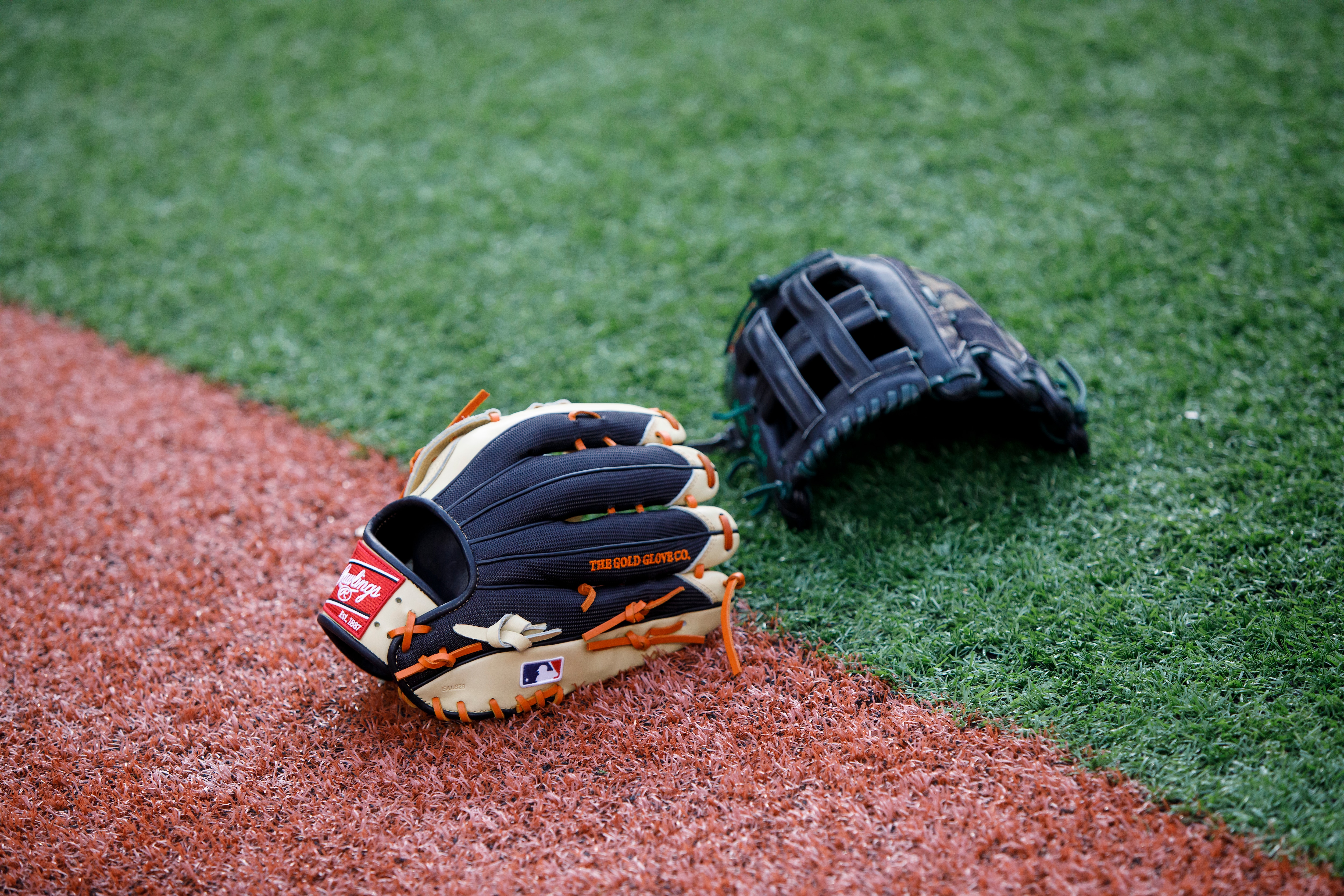 TORONTO, ON - OCTOBER 01: Rawlings baseball gloves lay on the turf ahead of the Toronto Blue Jays MLB game against the Baltimore Orioles at Rogers Centre on October 1, 2021 in Toronto, Ontario. (Photo by Cole Burston/Getty Images)