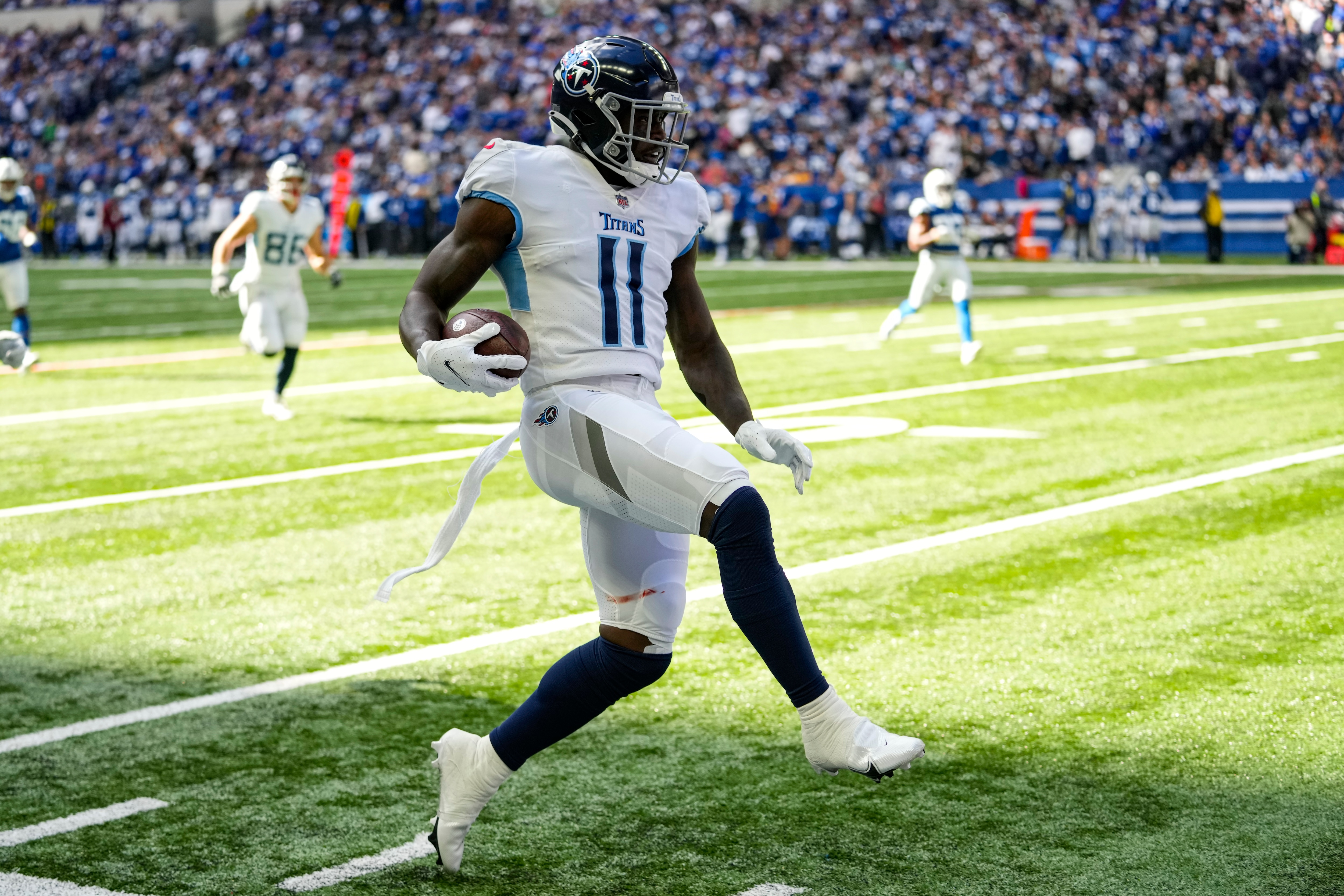 Tennessee Titans wide receiver A.J. Brown (11) heads to the end zone for a touchdown against the Indianapolis Colts in the first half of an NFL football game in Indianapolis, Sunday, Oct. 31, 2021. (AP Photo/AJ Mast)