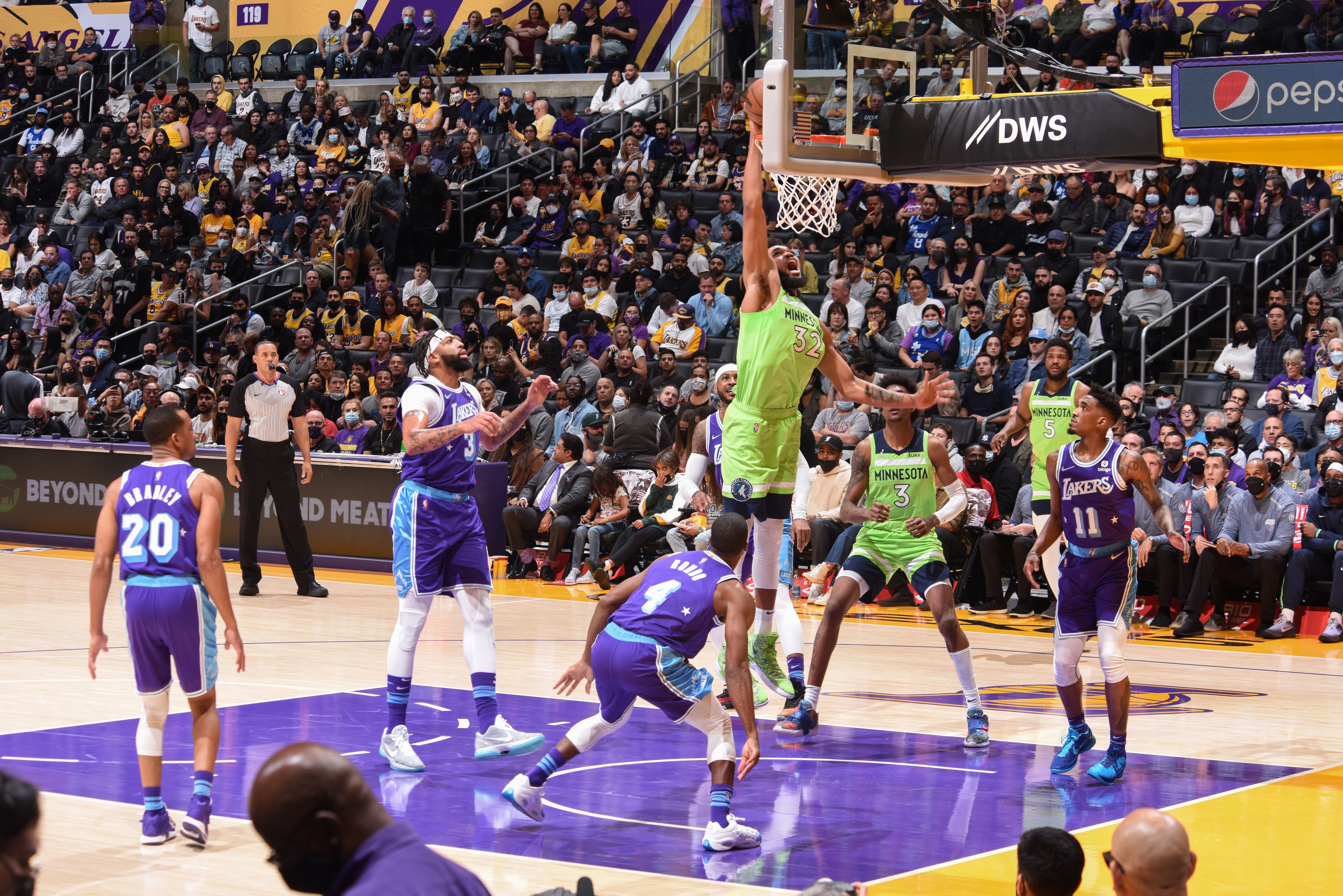 LOS ANGELES, CA - NOVEMBER 12: Karl-Anthony Towns #32 of the Minnesota Timberwolves shoots the ball during the game against the Los Angeles Lakers on November 12, 2021 at STAPLES Center in Los Angeles, California. NOTE TO USER: User expressly acknowledges and agrees that, by downloading and/or using this Photograph, user is consenting to the terms and conditions of the Getty Images License Agreement. Mandatory Copyright Notice: Copyright 2021 NBAE (Photo by Adam Pantozzi/NBAE via Getty Images)