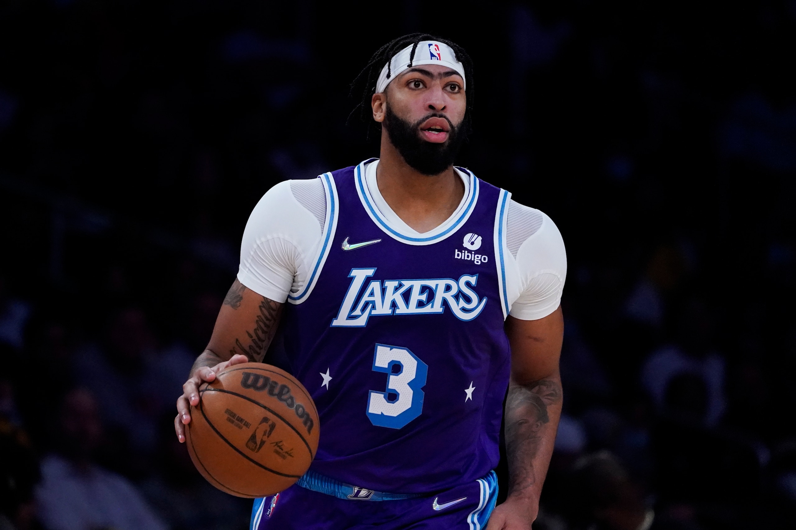 Los Angeles Lakers' Anthony Davis dribbles the ball during the first half of an NBA basketball game against the Minnesota Timberwolves Friday, Nov. 12, 2021, in Los Angeles. (AP Photo/Jae C. Hong)