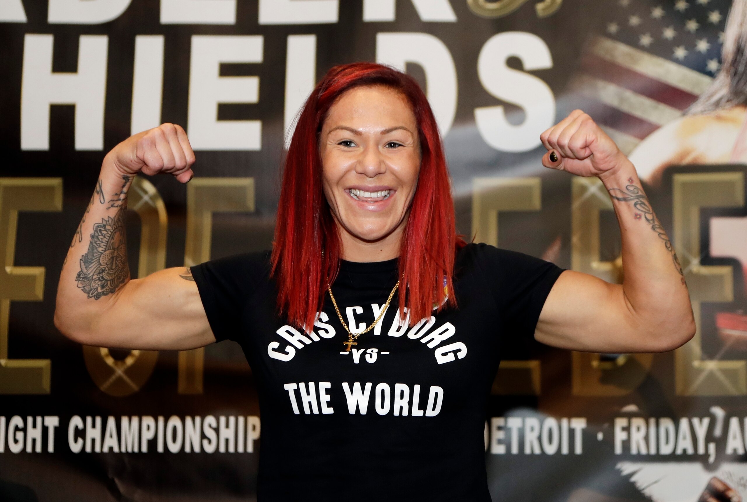 Brazilian-American mixed martial arts superstar, current UFC Women's Featherweight Champion, and Claressa Shields sparring partner, Cris Cyborg, poses before Shields weighs in, Thursday, Aug. 3, 2017, in Detroit. (AP Photo/Carlos Osorio)