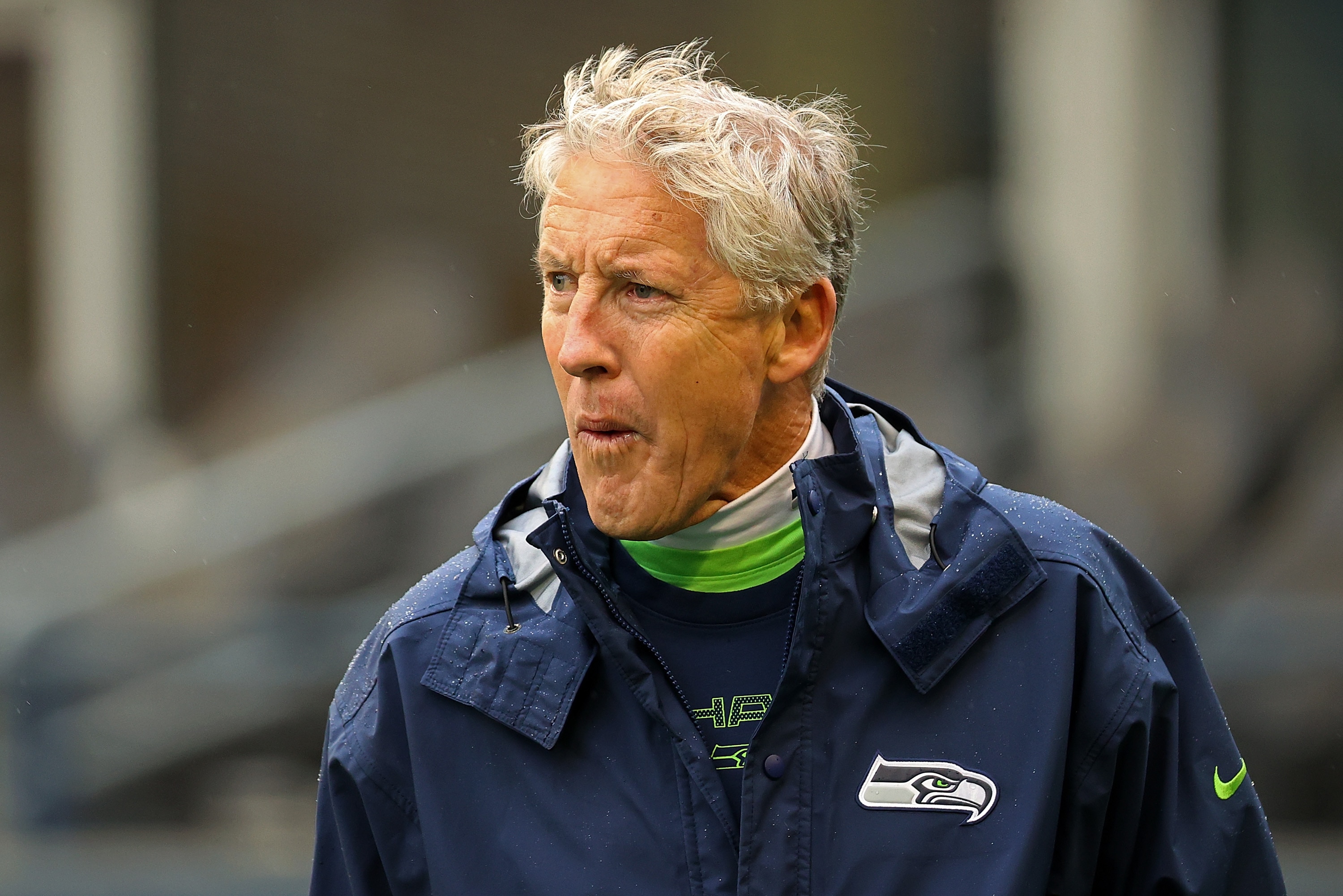SEATTLE, WASHINGTON - OCTOBER 25:  Head coach Pete Carroll of the Seattle Seahawks watches action prior to a game  at Lumen Field on October 25, 2021 in Seattle, Washington. (Photo by Abbie Parr/Getty Images)
