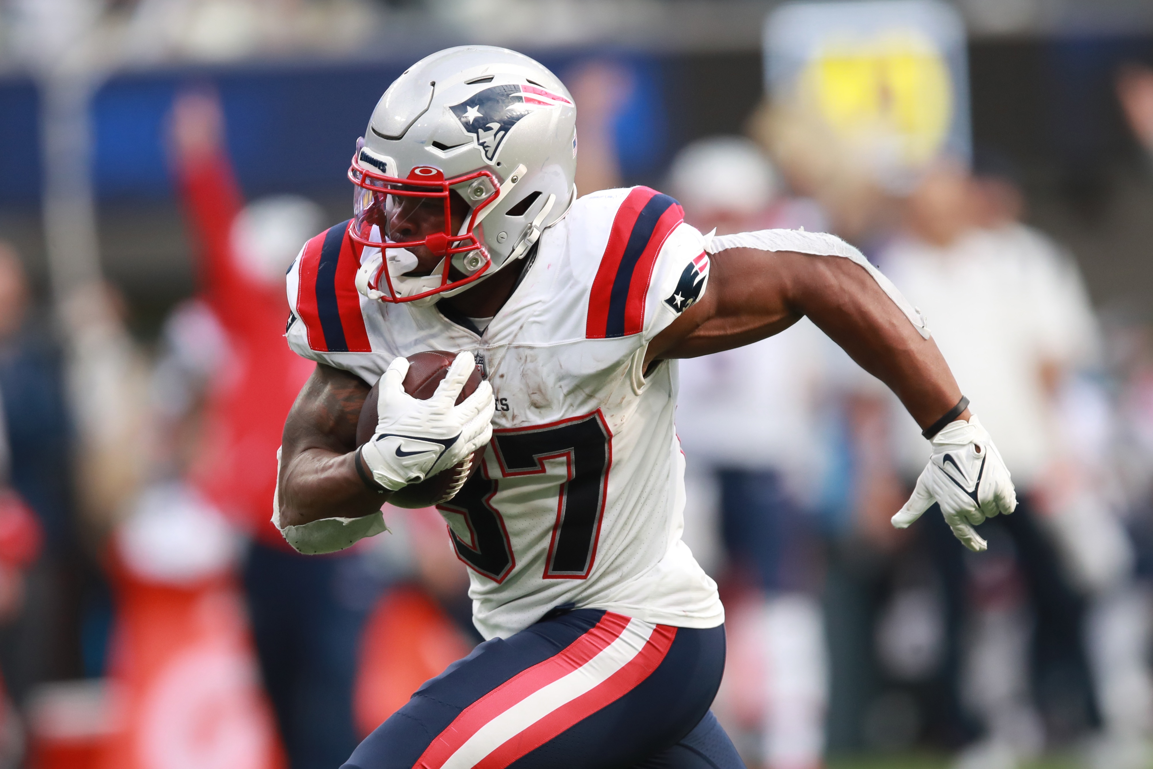 INGLEWOOD, CALIFORNIA - OCTOBER 31: Damien Harris #37 of the New England Patriots runs with the ball in the third quarter against the Los Angeles Chargers at SoFi Stadium on October 31, 2021 in Inglewood, California. (Photo by Joe Scarnici/Getty Images)