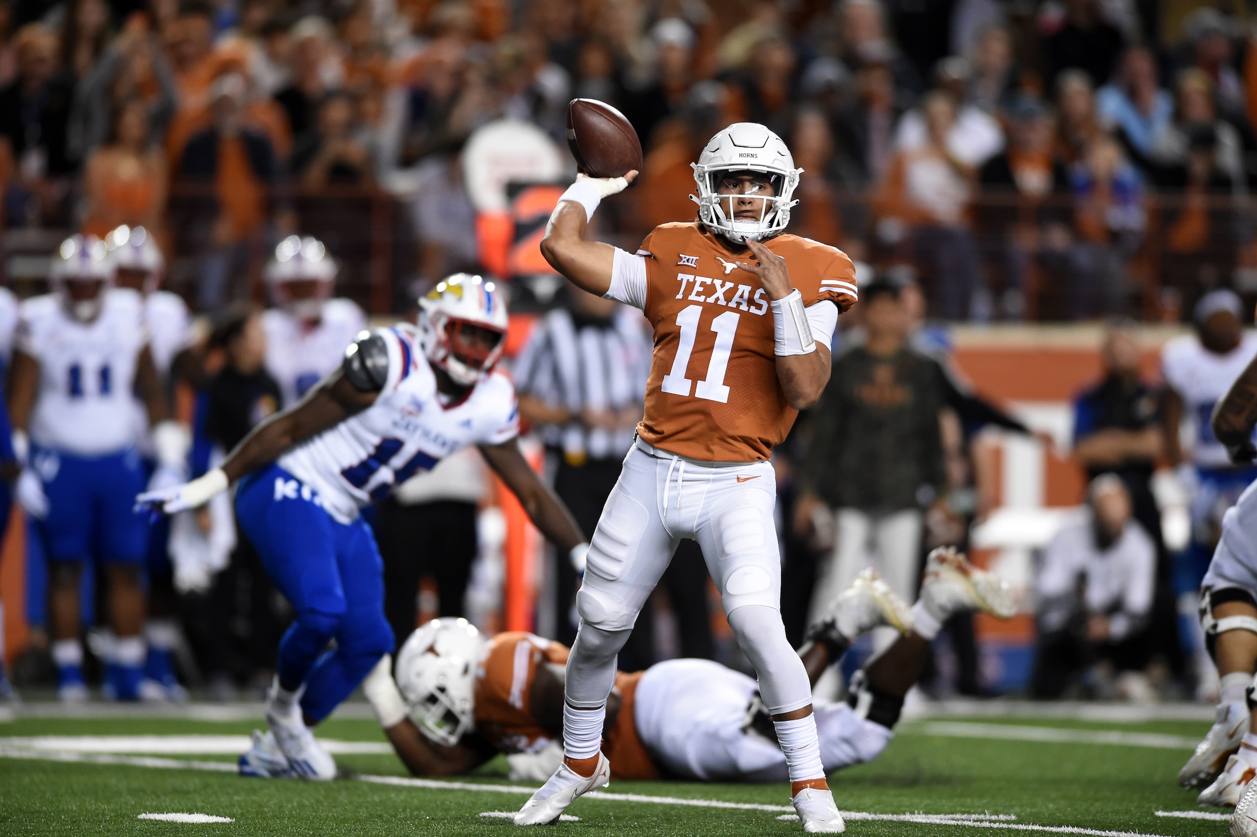 AUSTIN, TX - NOVEMBER 13: Texas Longhorns QB Casey Thompson (11) throws a pass during game between the Kansas Jayhawks and the Texas Longhorns on November 13, 2021 at Darrell K Royal-Texas Memorial Stadium in Austin, TX. (Photo by John Rivera/Icon Sportswire via Getty Images) AUSTIN, TX - NOVEMBER 13: Texas Longhorns QB Casey Thompson (11) throws a pass during game between the Kansas Jayhawks and the Texas Longhorns on November 13, 2021 at Darrell K Royal-Texas Memorial Stadium in Austin, TX. (Photo by John Rivera/Icon Sportswire via Getty Images)
