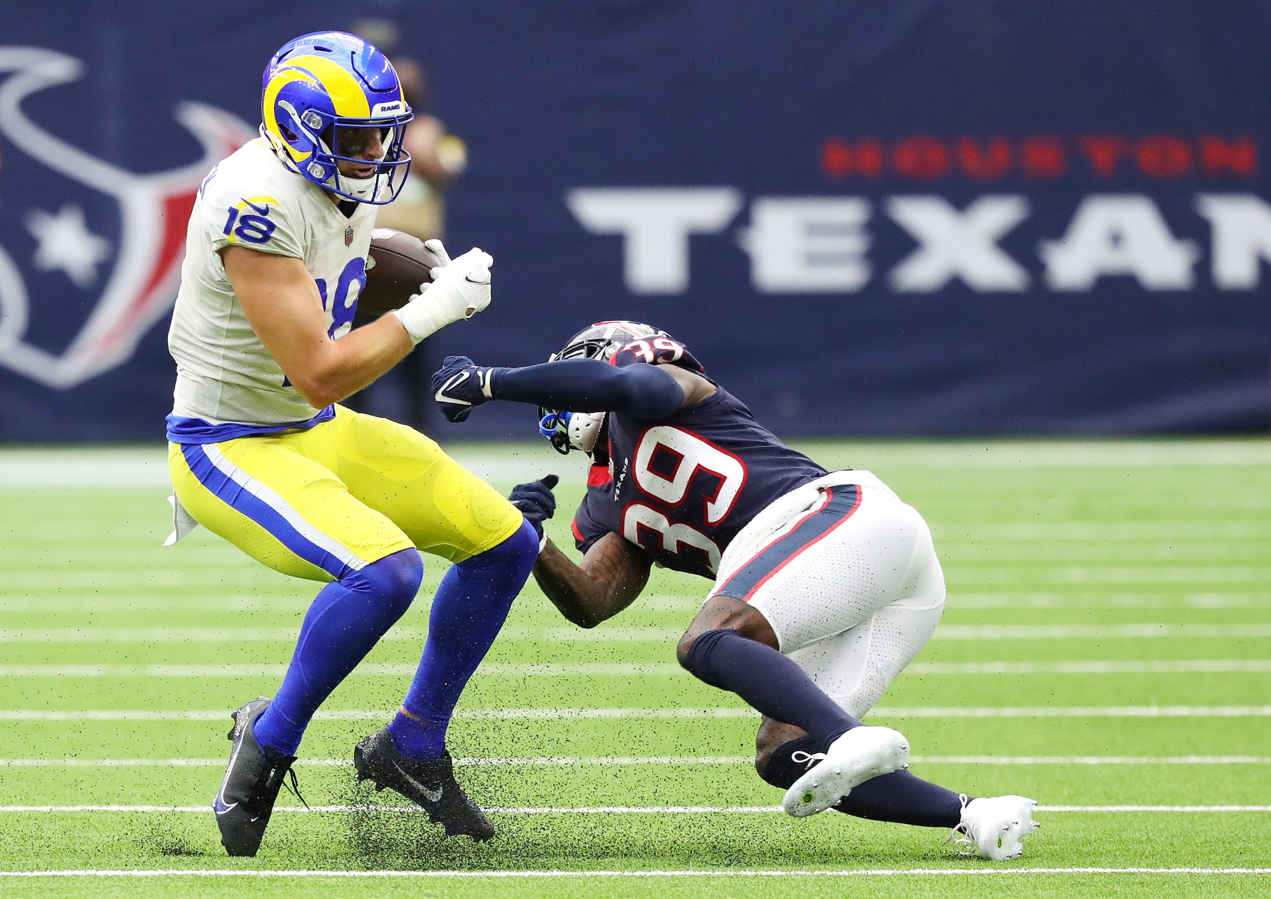HOUSTON, TEXAS - OCTOBER 31: Ben Skowronek #18 of the Los Angeles Rams catches the ball and avoids a tackle by Terrance Mitchell #39 of the Houston Texans during the second half at NRG Stadium on October 31, 2021 in Houston, Texas. (Photo by Bob Levey/Getty Images) HOUSTON, TEXAS - OCTOBER 31: Ben Skowronek #18 of the Los Angeles Rams catches the ball and avoids a tackle by Terrance Mitchell #39 of the Houston Texans during the second half at NRG Stadium on October 31, 2021 in Houston, Texas. (Photo by Bob Levey/Getty Images)
