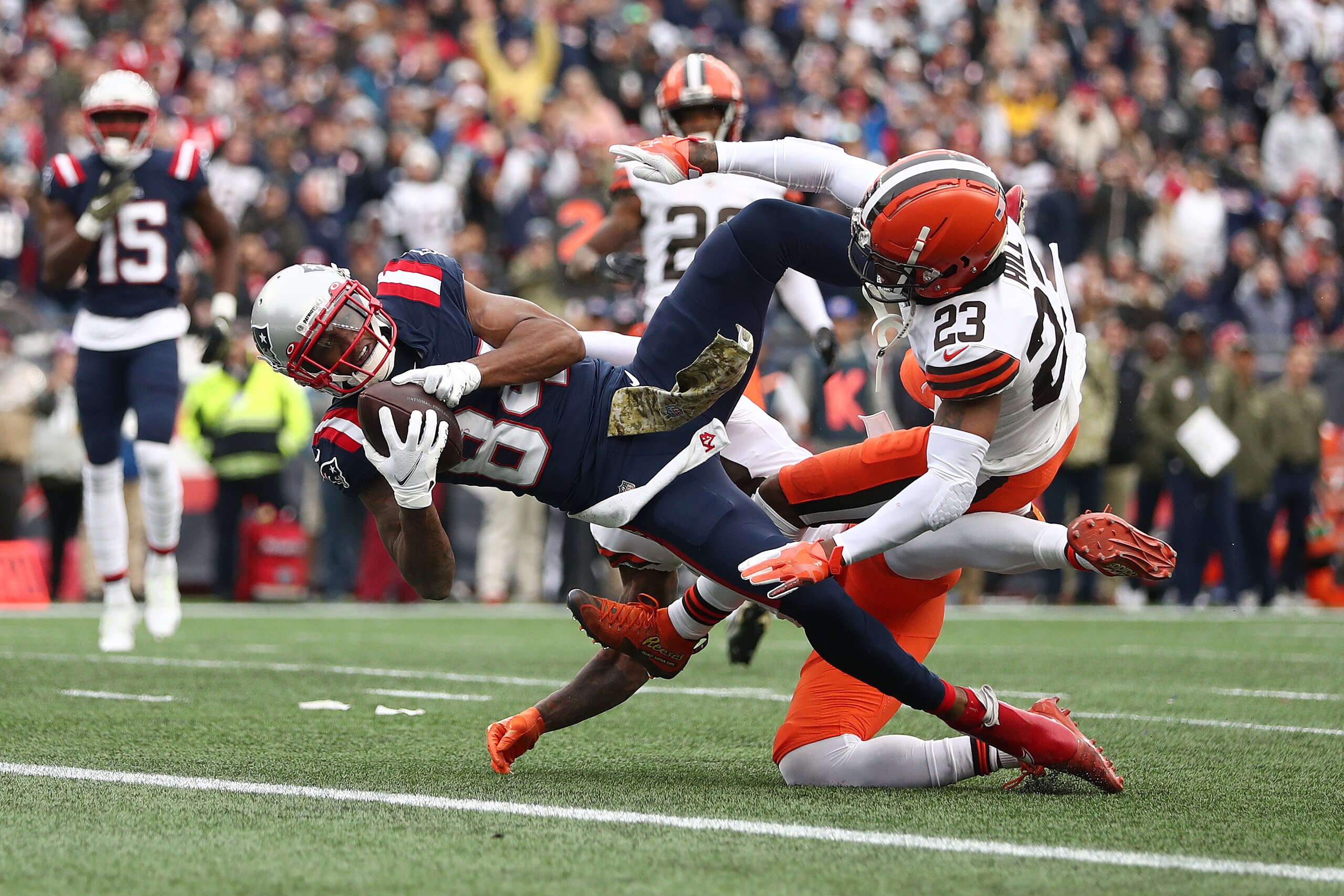 FOXBOROUGH, MASSACHUSETTS - NOVEMBER 14: Kendrick Bourne #84 of the New England Patriots completes a touchdown pass against Troy Hill #23 of the Cleveland Browns during the second quarter at Gillette Stadium on November 14, 2021 in Foxborough, Massachusetts. (Photo by Adam Glanzman/Getty Images) FOXBOROUGH, MASSACHUSETTS - NOVEMBER 14: Kendrick Bourne #84 of the New England Patriots completes a touchdown pass against Troy Hill #23 of the Cleveland Browns during the second quarter at Gillette Stadium on November 14, 2021 in Foxborough, Massachusetts. (Photo by Adam Glanzman/Getty Images)