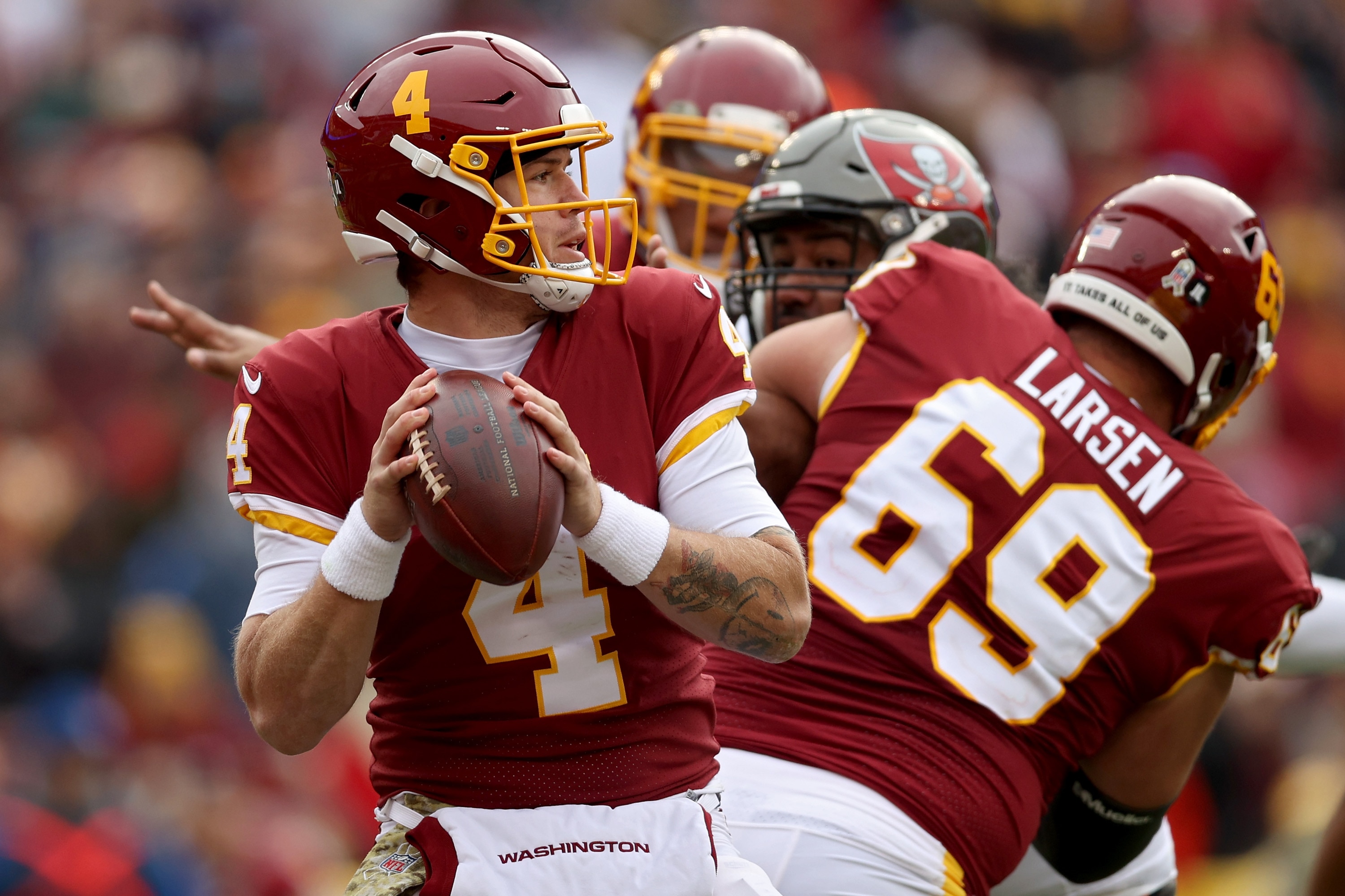 LANDOVER, MARYLAND - NOVEMBER 14: Taylor Heinicke #4 of the Washington Football Team throws the ball during the third quarter against the Tampa Bay Buccaneers at FedExField on November 14, 2021 in Landover, Maryland. (Photo by Rob Carr/Getty Images)