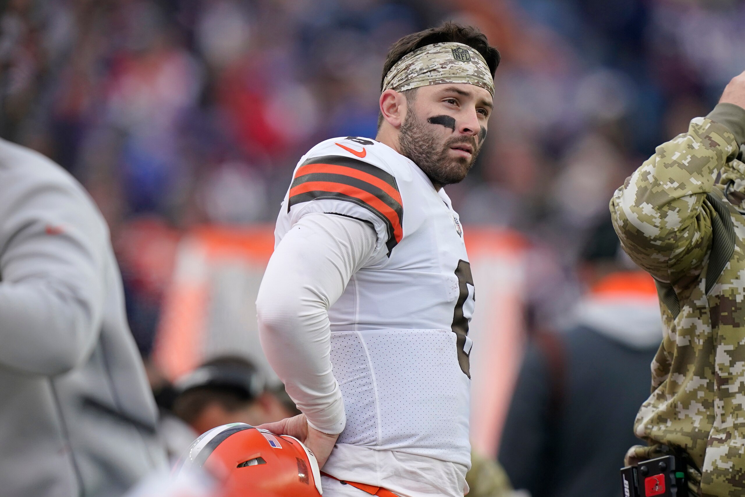 Cleveland Browns quarterback Baker Mayfield (6) watches from the sideline during the second half of an NFL football game against the New England Patriots, Sunday, Nov. 14, 2021, in Foxborough, Mass. (AP Photo/Steven Senne)