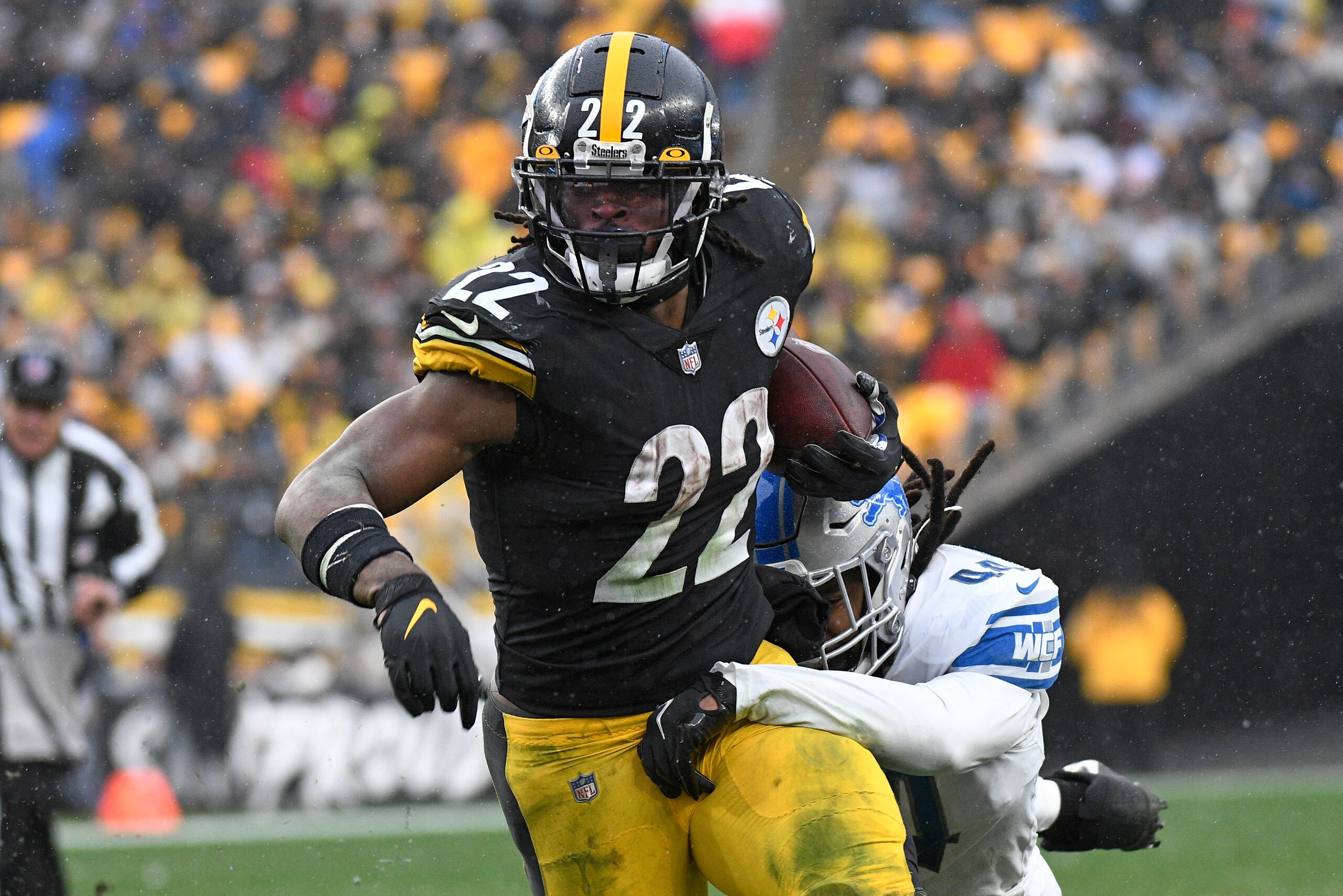 Pittsburgh Steelers running back Najee Harris (22) slips a tackle attempted by Detroit Lions inside linebacker Jalen Reeves-Maybin (44) during the second half of an NFL football game in Pittsburgh, Sunday, Nov. 14, 2021. (AP Photo/Don Wright)