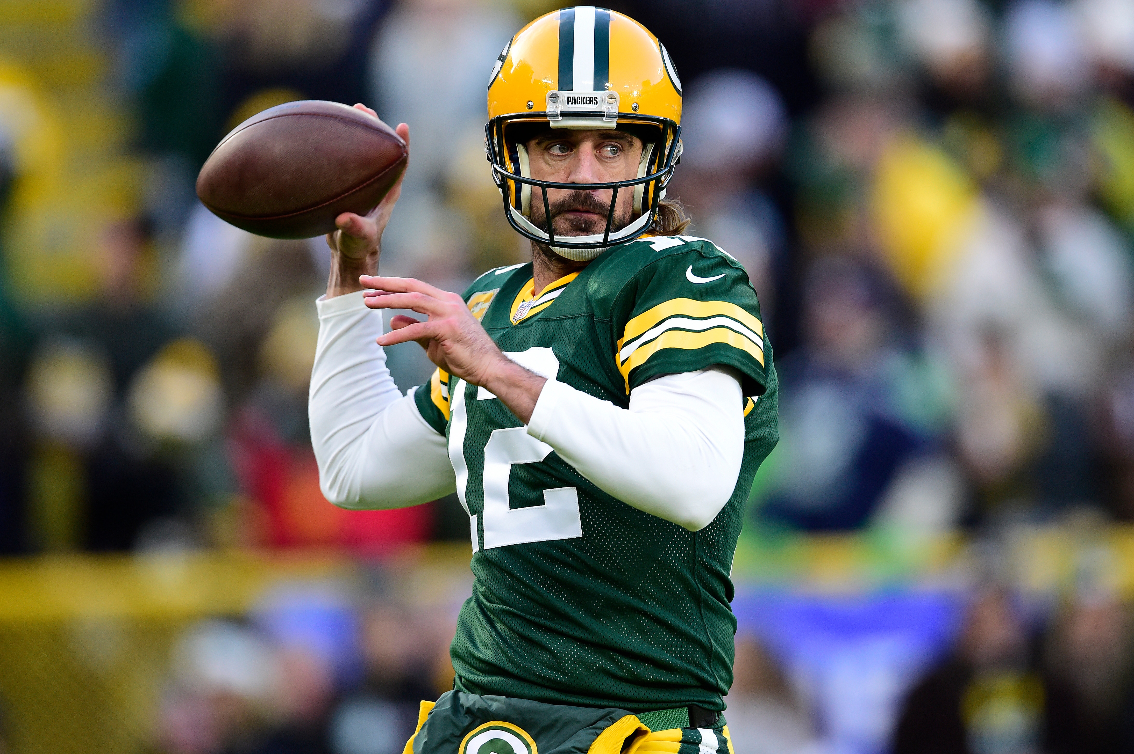 GREEN BAY, WISCONSIN - NOVEMBER 14: Aaron Rodgers #12 of the Green Bay Packers warms up before the game against the Seattle Seahawks at Lambeau Field on November 14, 2021 in Green Bay, Wisconsin. (Photo by Patrick McDermott/Getty Images)