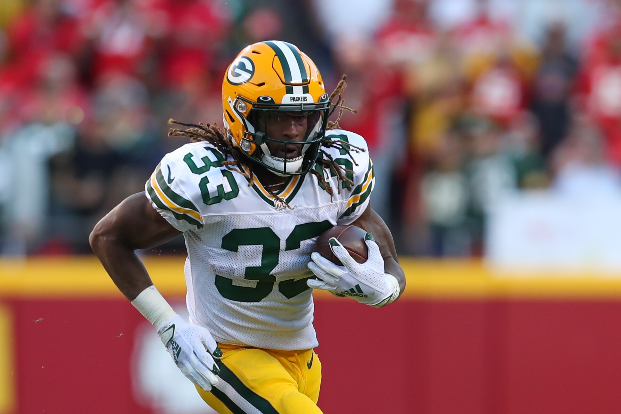 KANSAS CITY, MO - NOVEMBER 07: Green Bay Packers running back Aaron Jones (33) during a run in the first quarter of an NFL game between the Green Bay Packers and Kansas City Chiefs on Nov 7, 2021 at GEHA Field at Arrowhead Stadium in Kansas City, MO. (Photo by Scott Winters/Icon Sportswire via Getty Images)