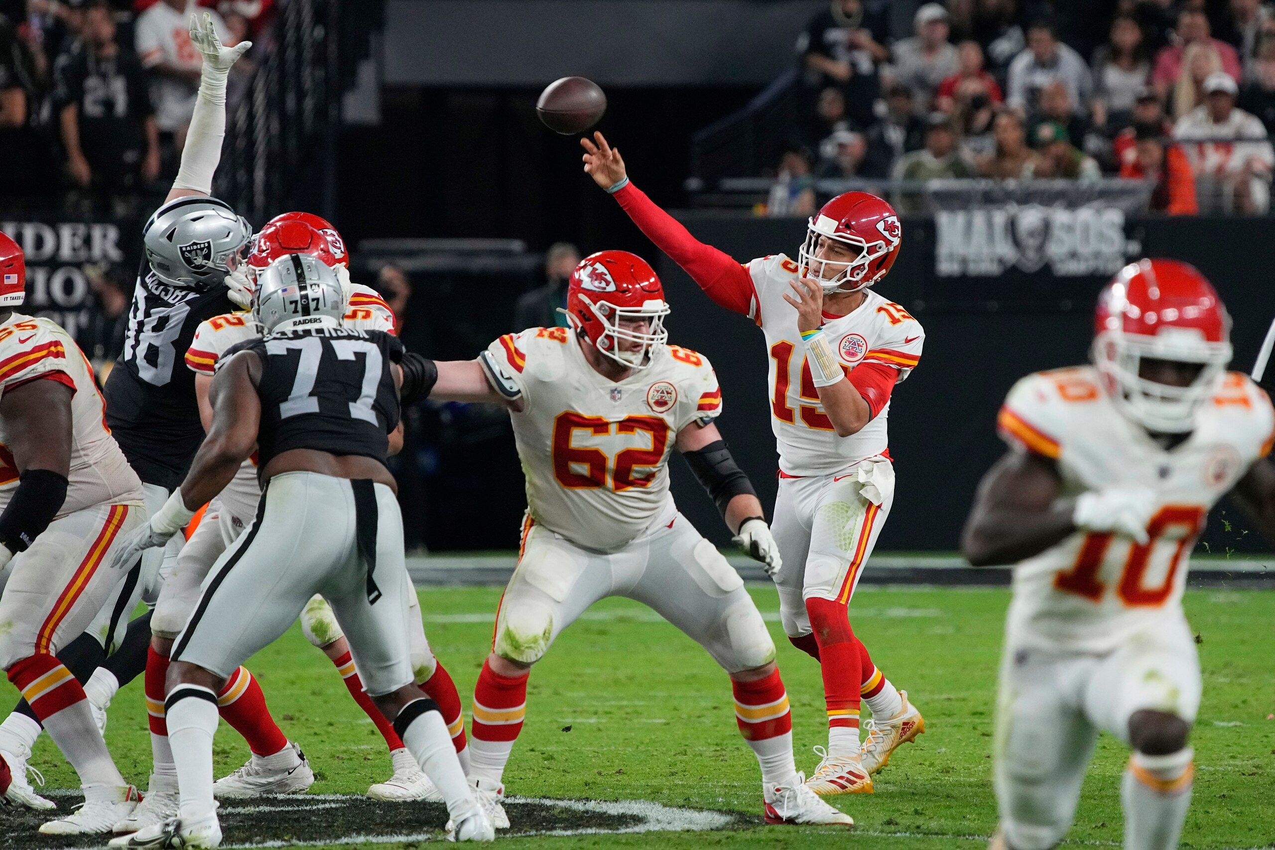 Kansas City Chiefs quarterback Patrick Mahomes (15) throws against the Las Vegas Raiders during the first half of an NFL football game, Sunday, Nov. 14, 2021, in Las Vegas. (AP Photo/Rick Scuteri)