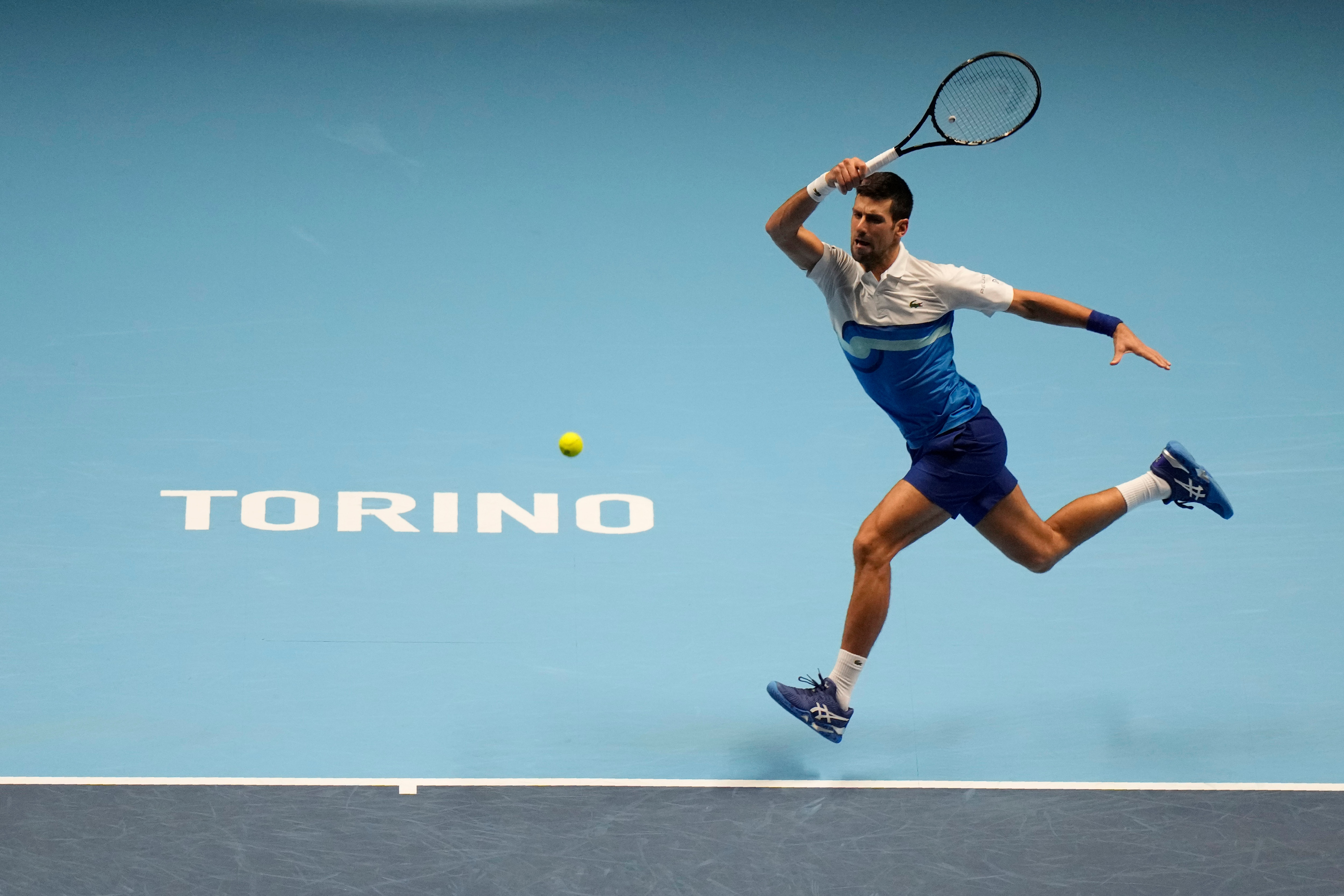 Serbia's Novak Djokovic returns the ball to Norways' Casper Ruud during their ATP World Tour Finals singles tennis match, at the Pala Alpitour in Turin, Monday, Nov. 15, 2021. (AP Photo/Luca Bruno)